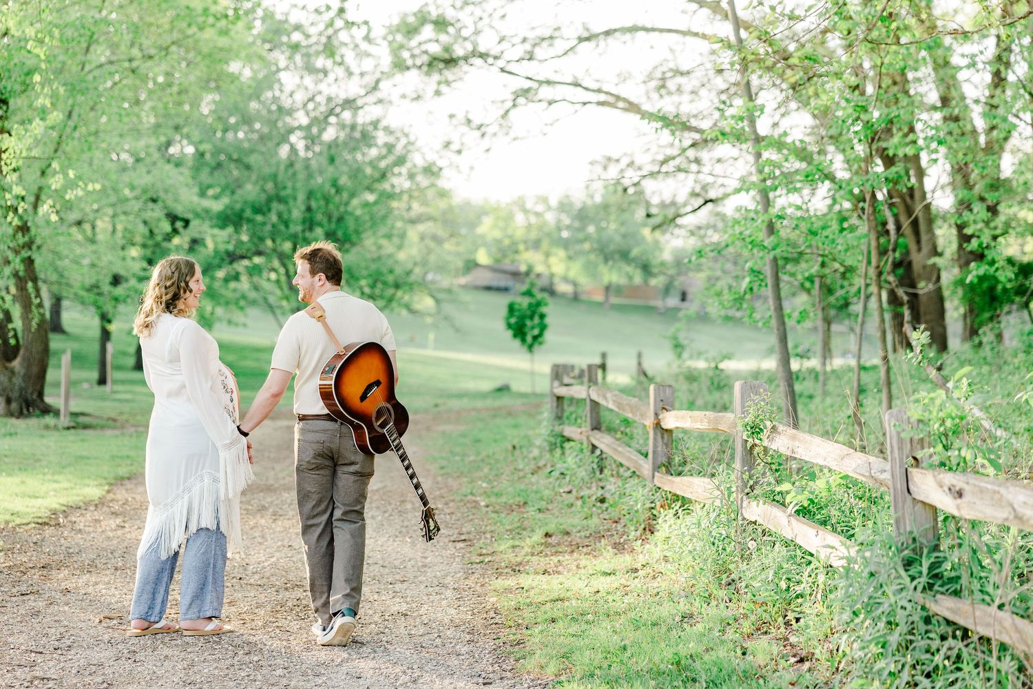 Expecting parents walking through Veterans Acres Nature Preserve during a Crystal Lake maternity session.