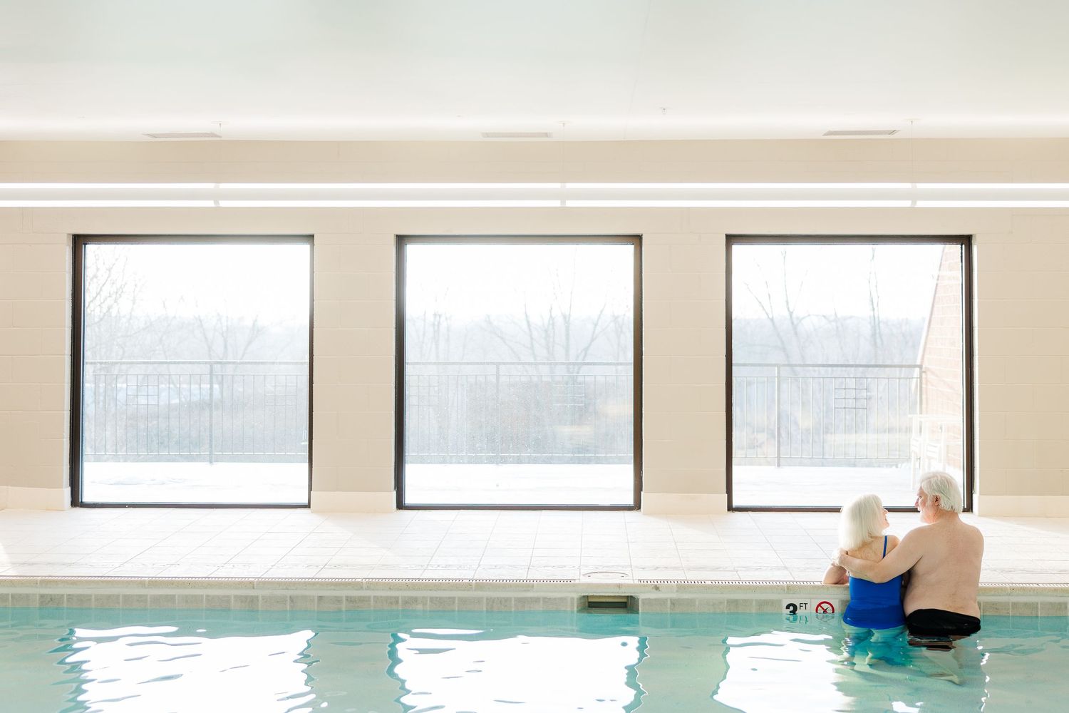 Beacon Hill senior living branding photo in Lombard, Illinois featuring resident in indoor pool