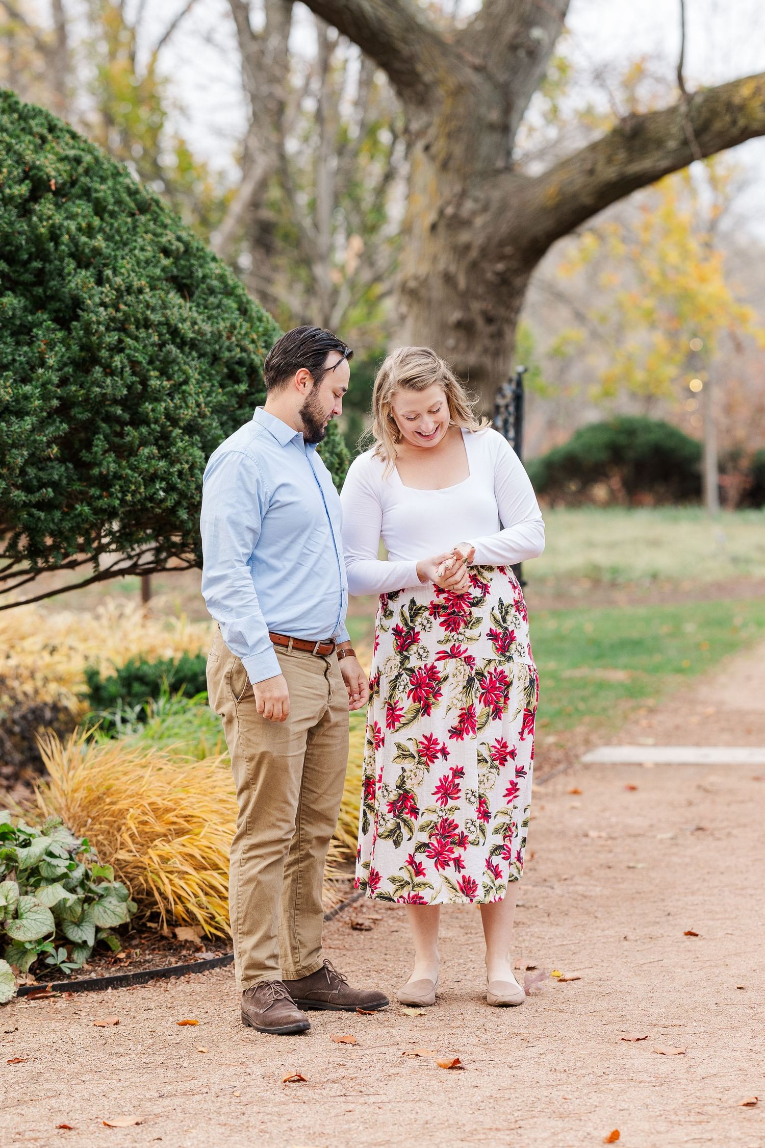 Man proposes to woman in the Keyhole Garden at Cantigny Park in Wheaton, IL