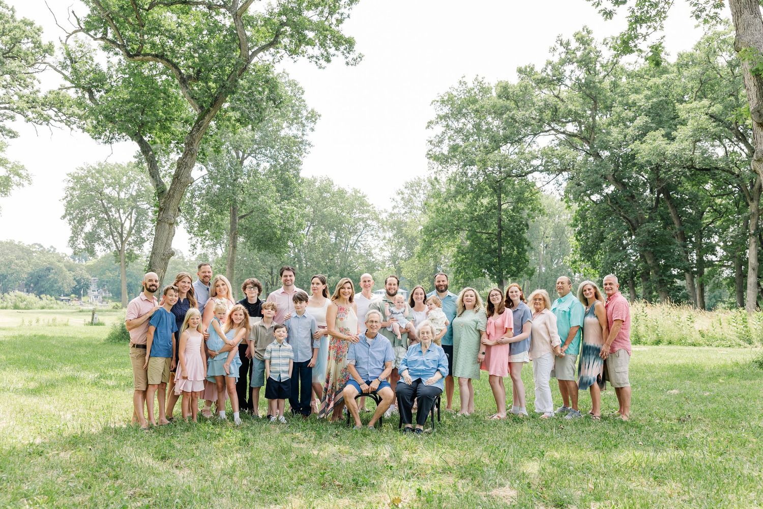 Large extended family portrait during a summer family reunion in Crystal Lake, Illinois by a Chicagoland family photographer.