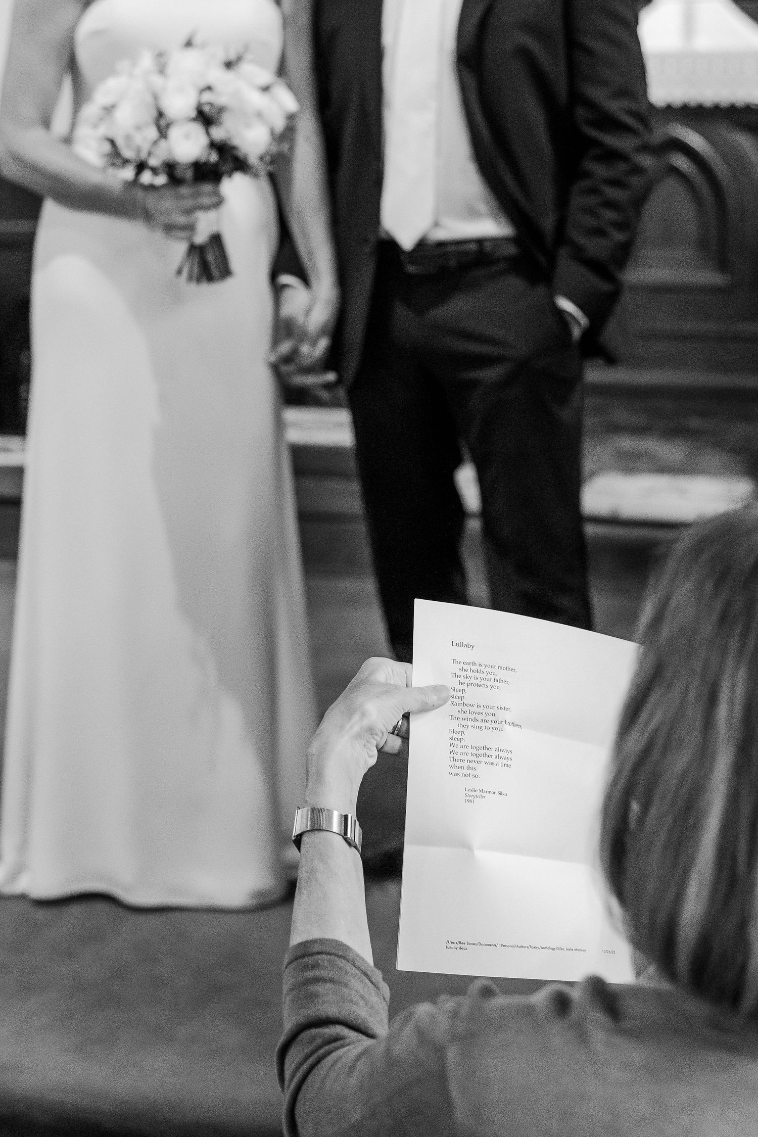 A black and white photo of ceremony program being held during a wedding service.
