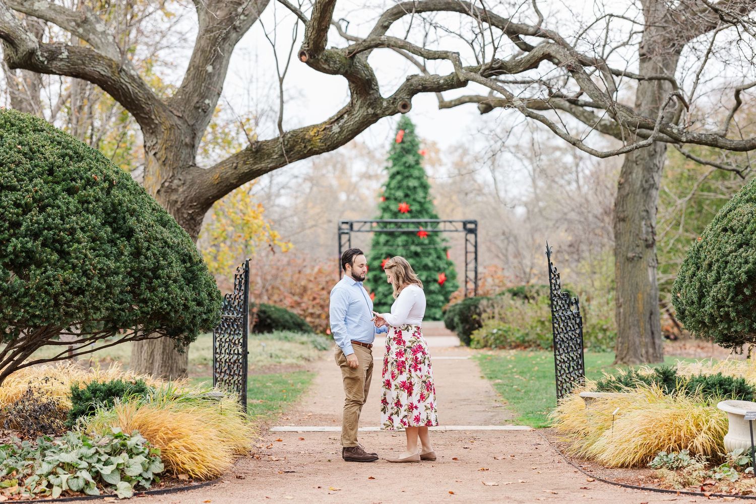 Man proposes to woman in the Keyhole Garden at Cantigny Park in Wheaton, IL