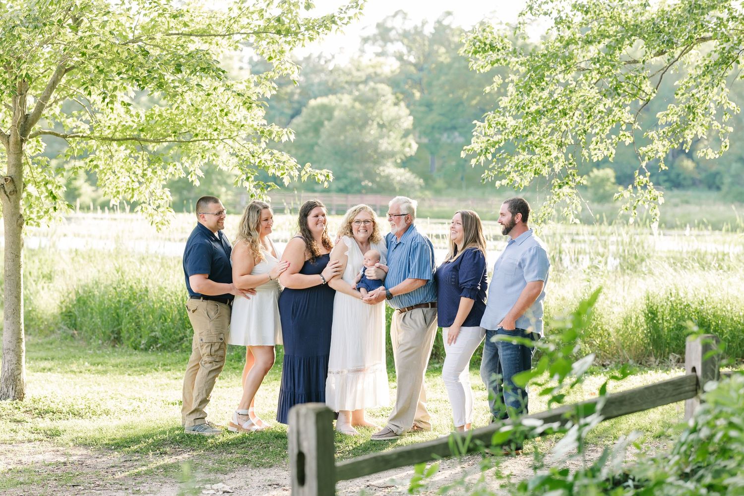 Extended family portrait on a nature trail at Veterans Acres Nature Center during a summer photo session in Crystal Lake