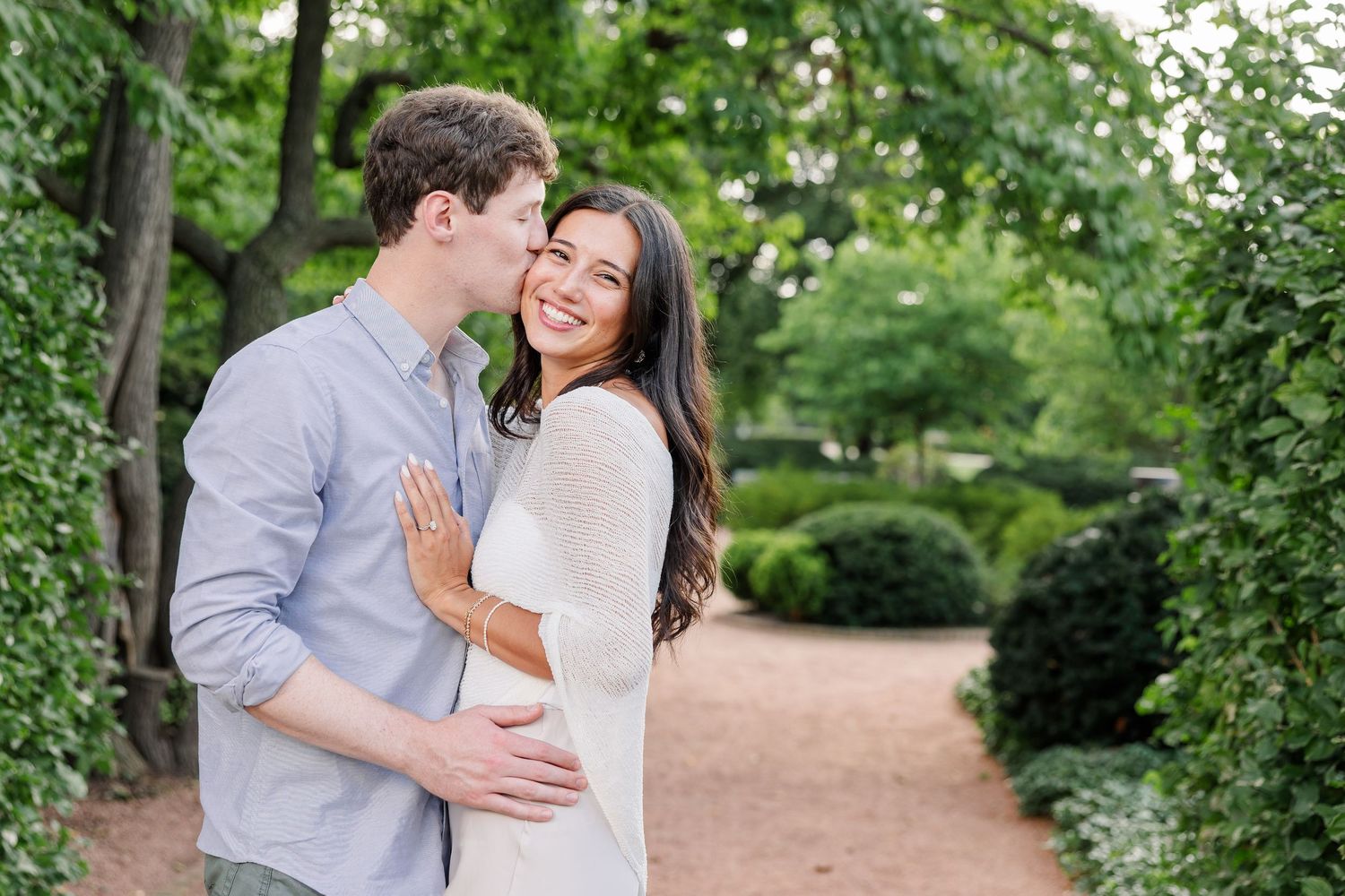 Jack wraps his arms around Alysia as they smile together after their proposal.