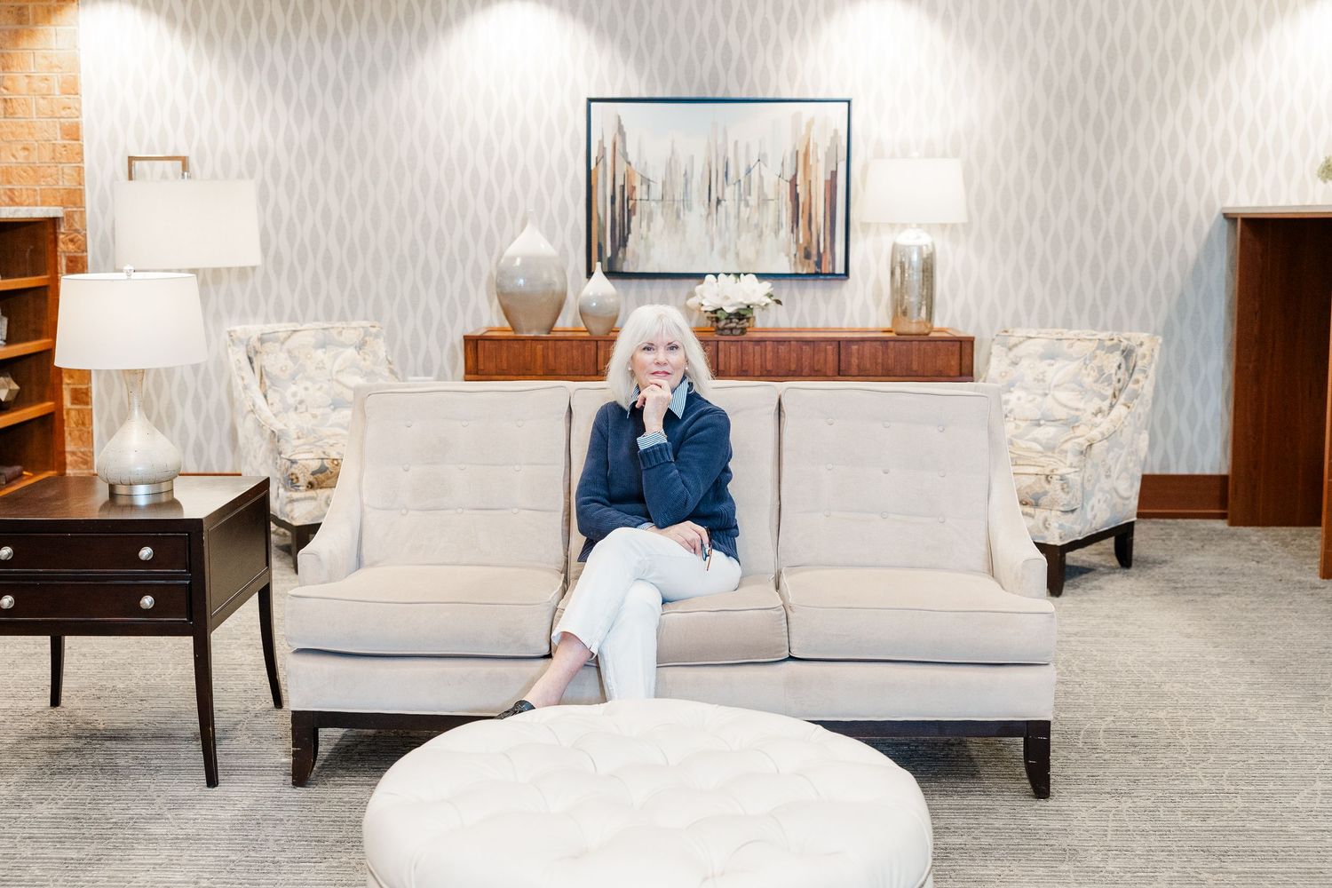 Beacon Hill senior living branding photo in Lombard, Illinois featuring resident seated in lobby