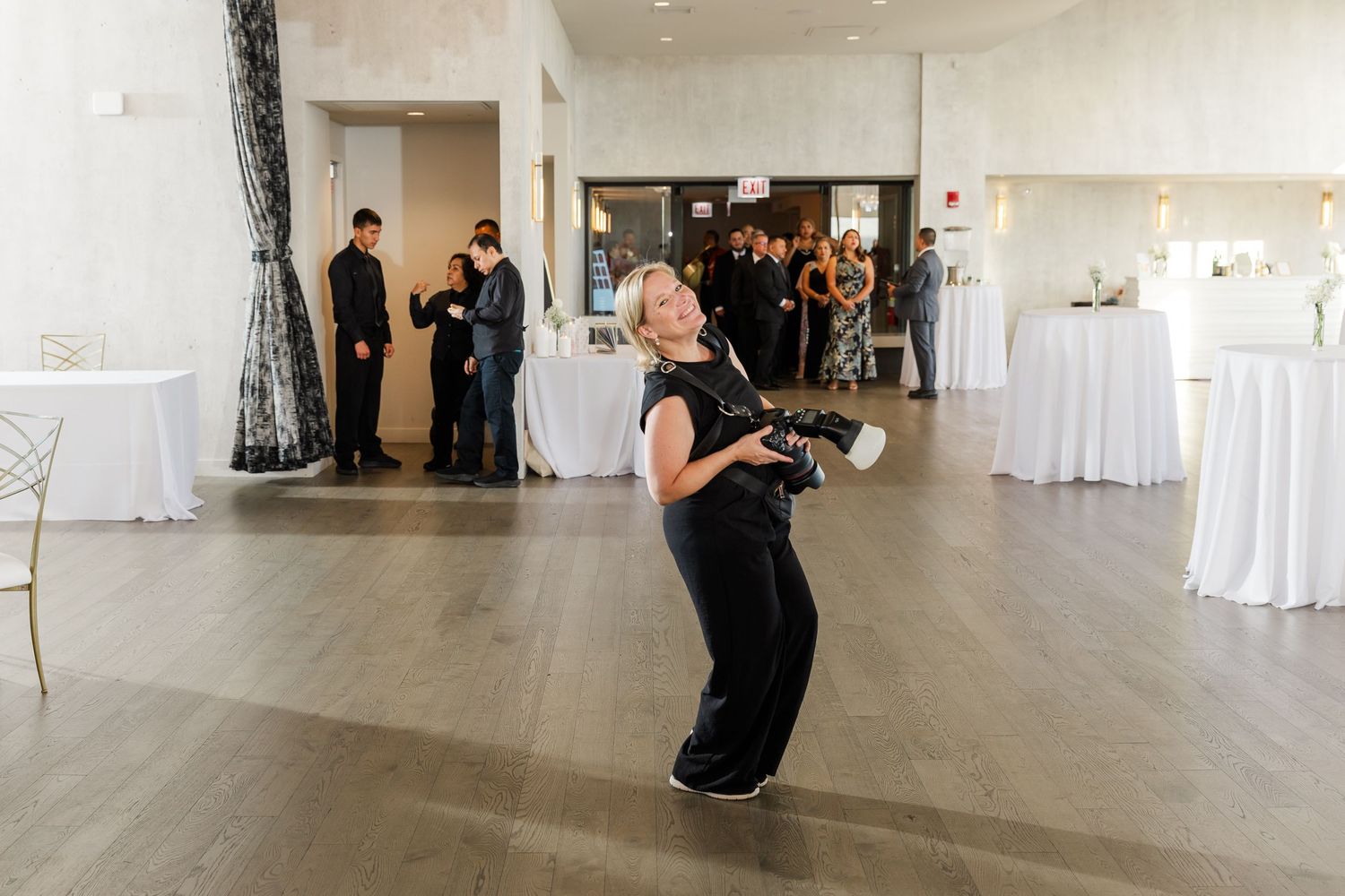 Cassie Lacina photographing a couple’s first dance at a wedding reception