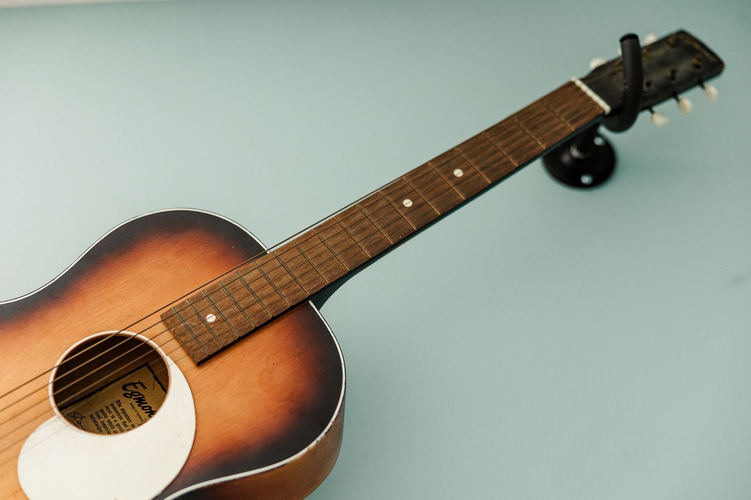 Guitar detail in twin boys’ nursery during a music-inspired maternity session in Crystal Lake, Illinois.