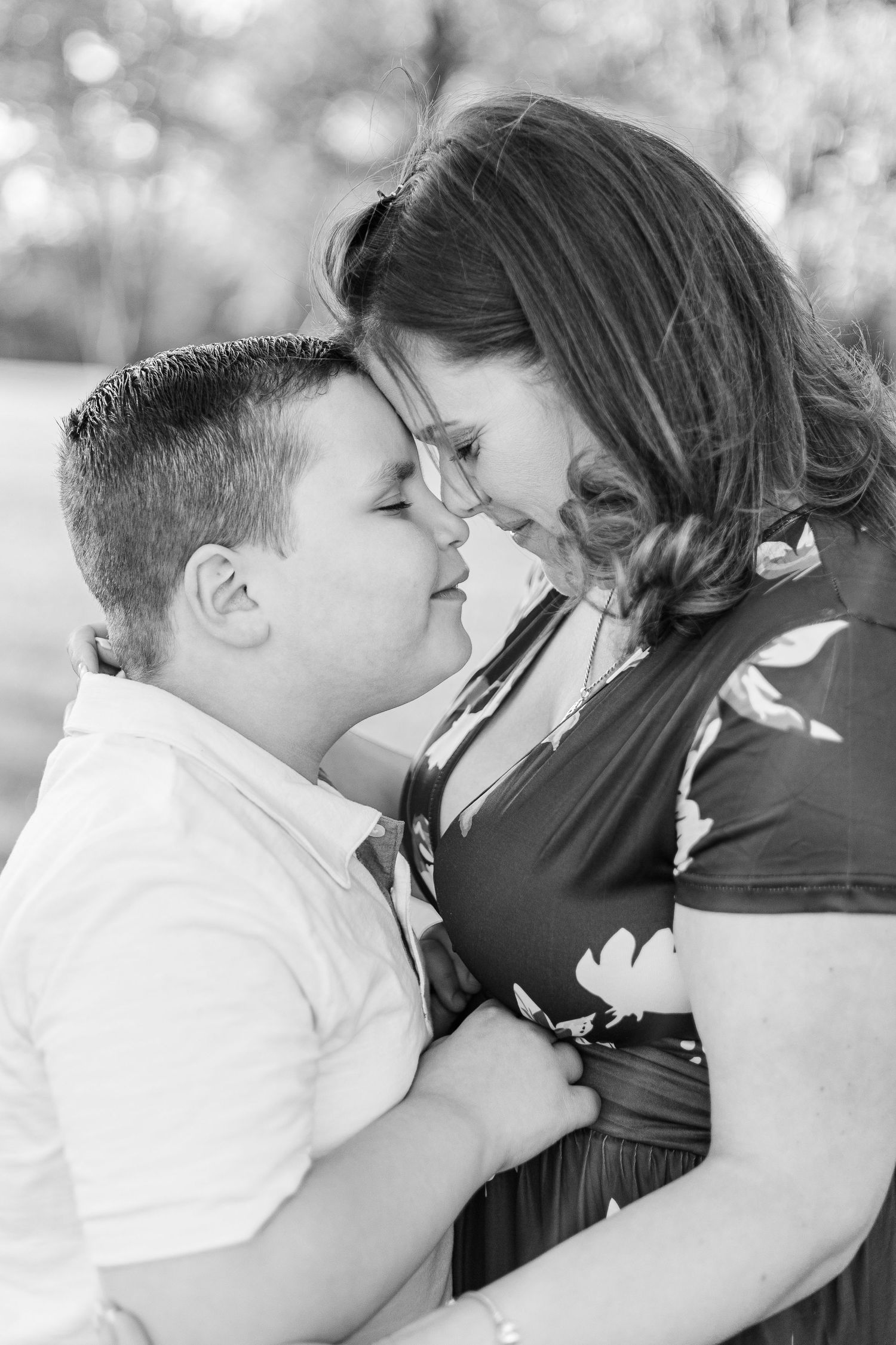 Black and white intimate portrait showing emotional connection between two people.