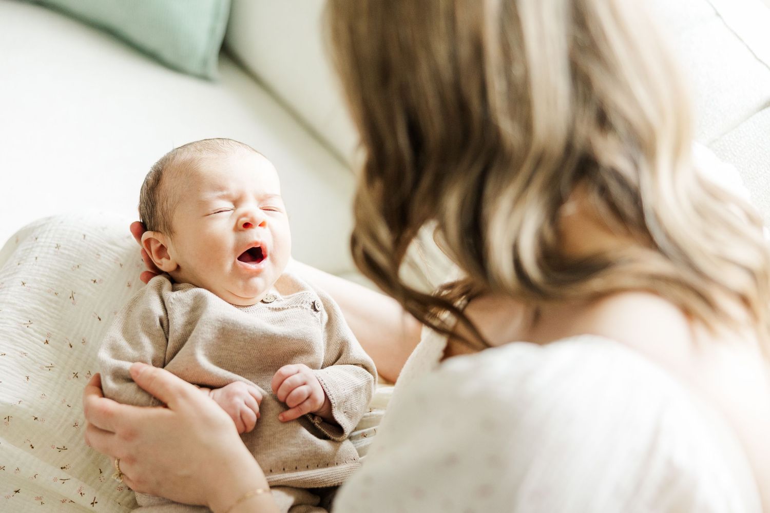 Palatine IL lifestyle newborn photographer capturing a yawning baby during a natural in-home newborn photography session