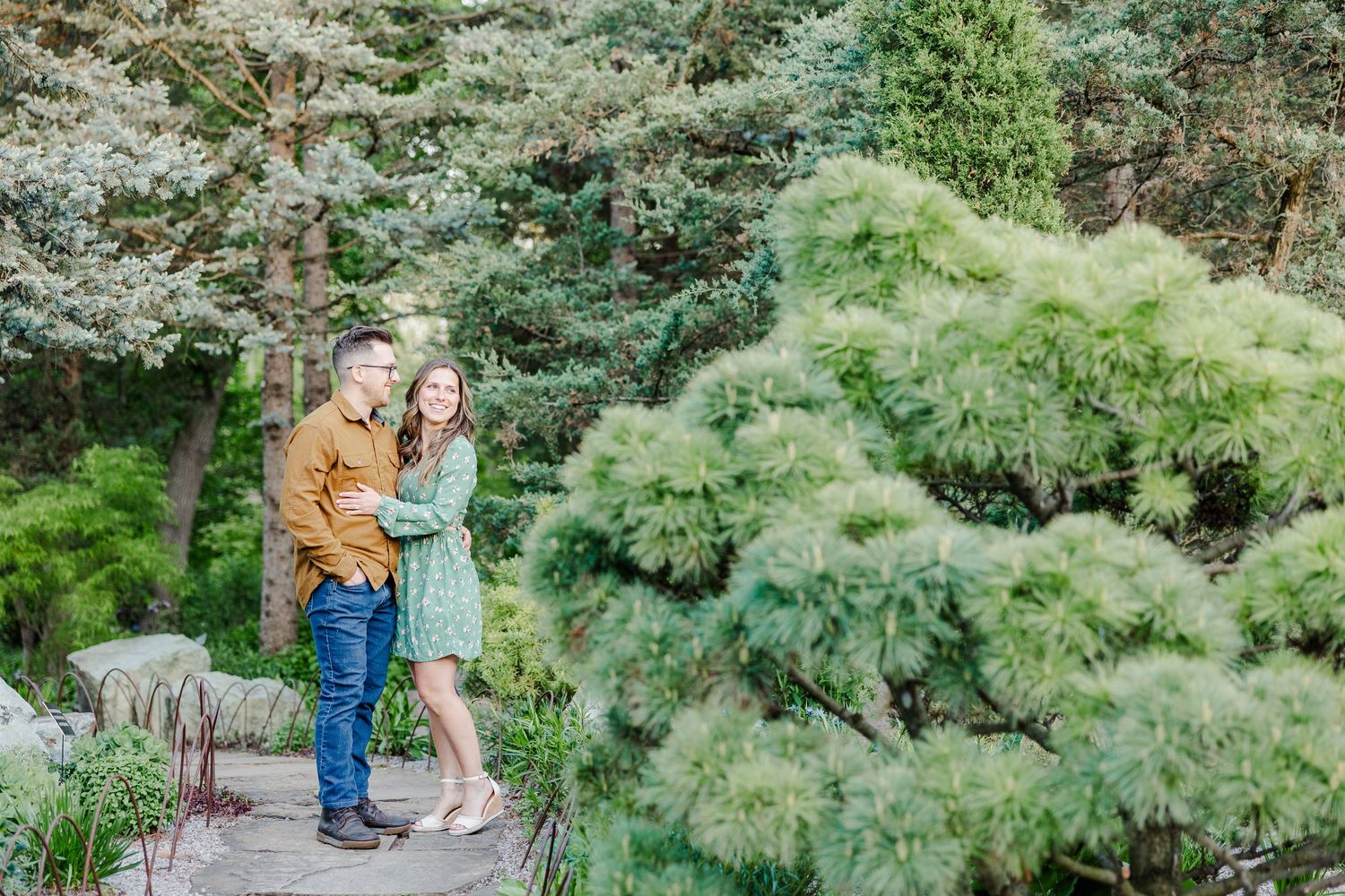Engaged couple standing together in the gardens at Cantigny Park