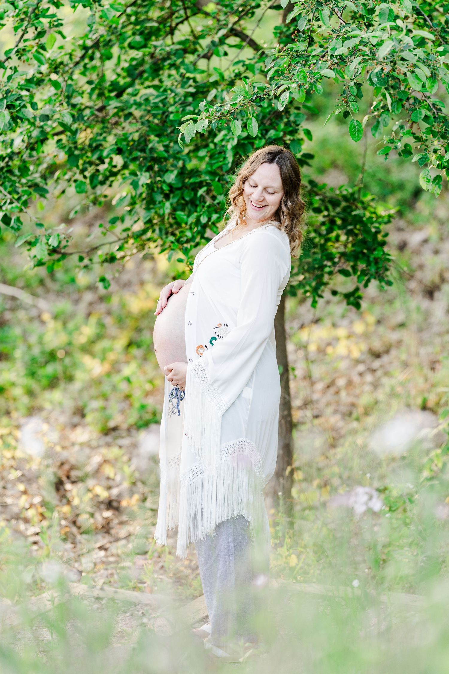Golden hour maternity portrait at Veterans Acres Nature Preserve in Crystal Lake, Illinois.