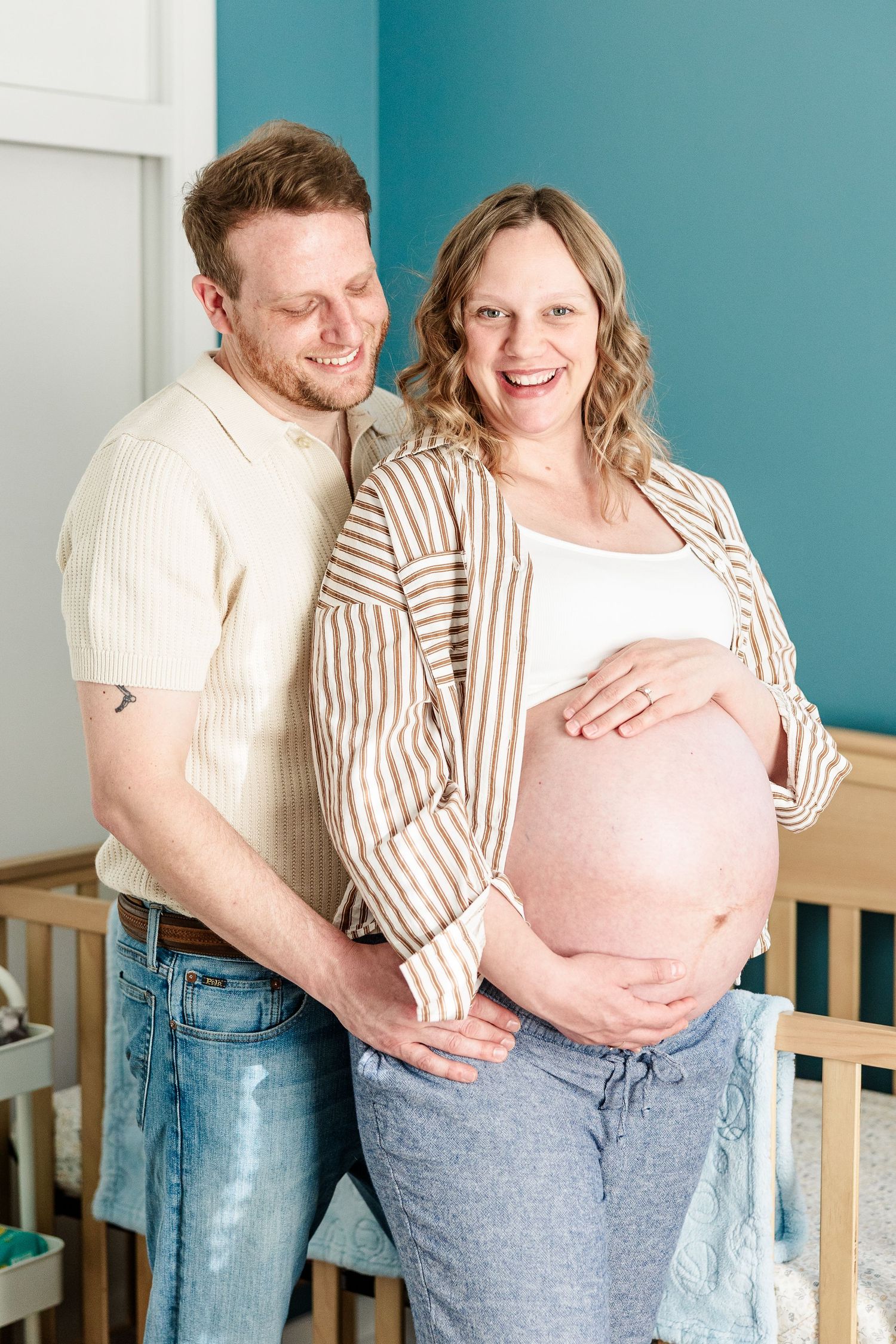 Cozy in-home maternity photos in a twin boys’ nursery during a Crystal Lake maternity session.