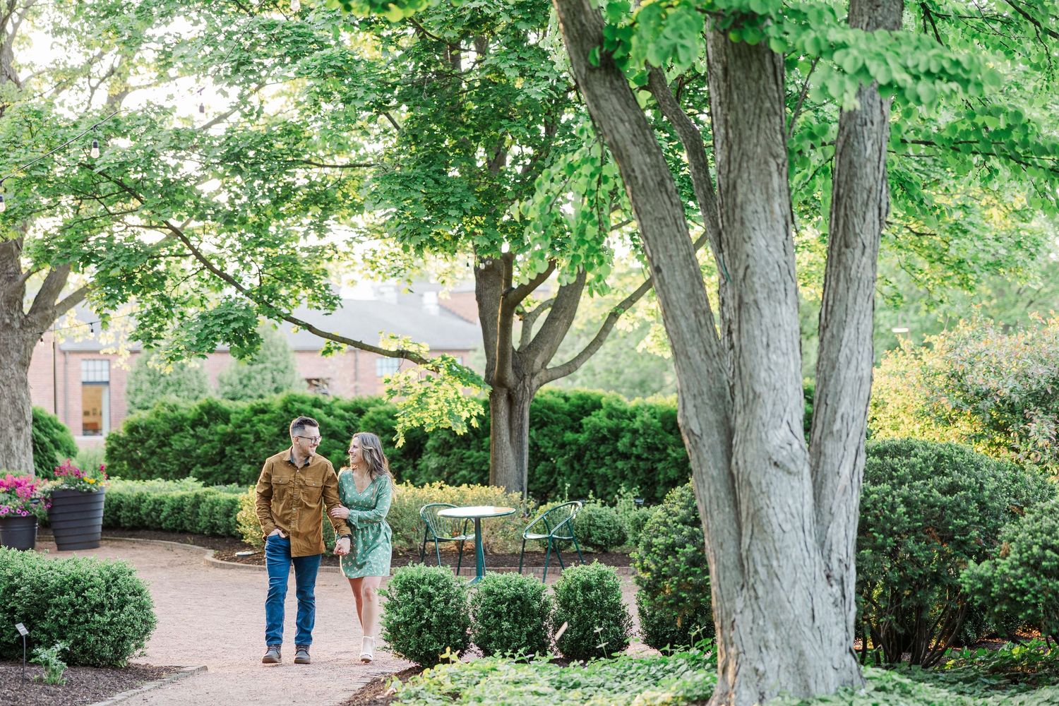 Wide garden engagement portrait at Cantigny Park in Wheaton Illinois