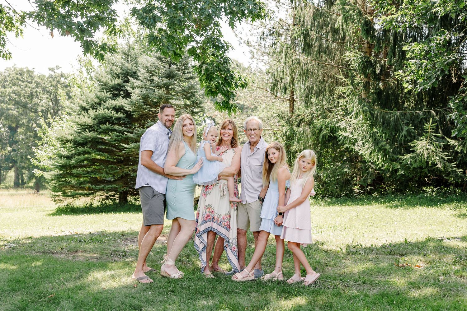 Grandparents with their grandchildren during a summer extended family session in Crystal Lake, Illinois.