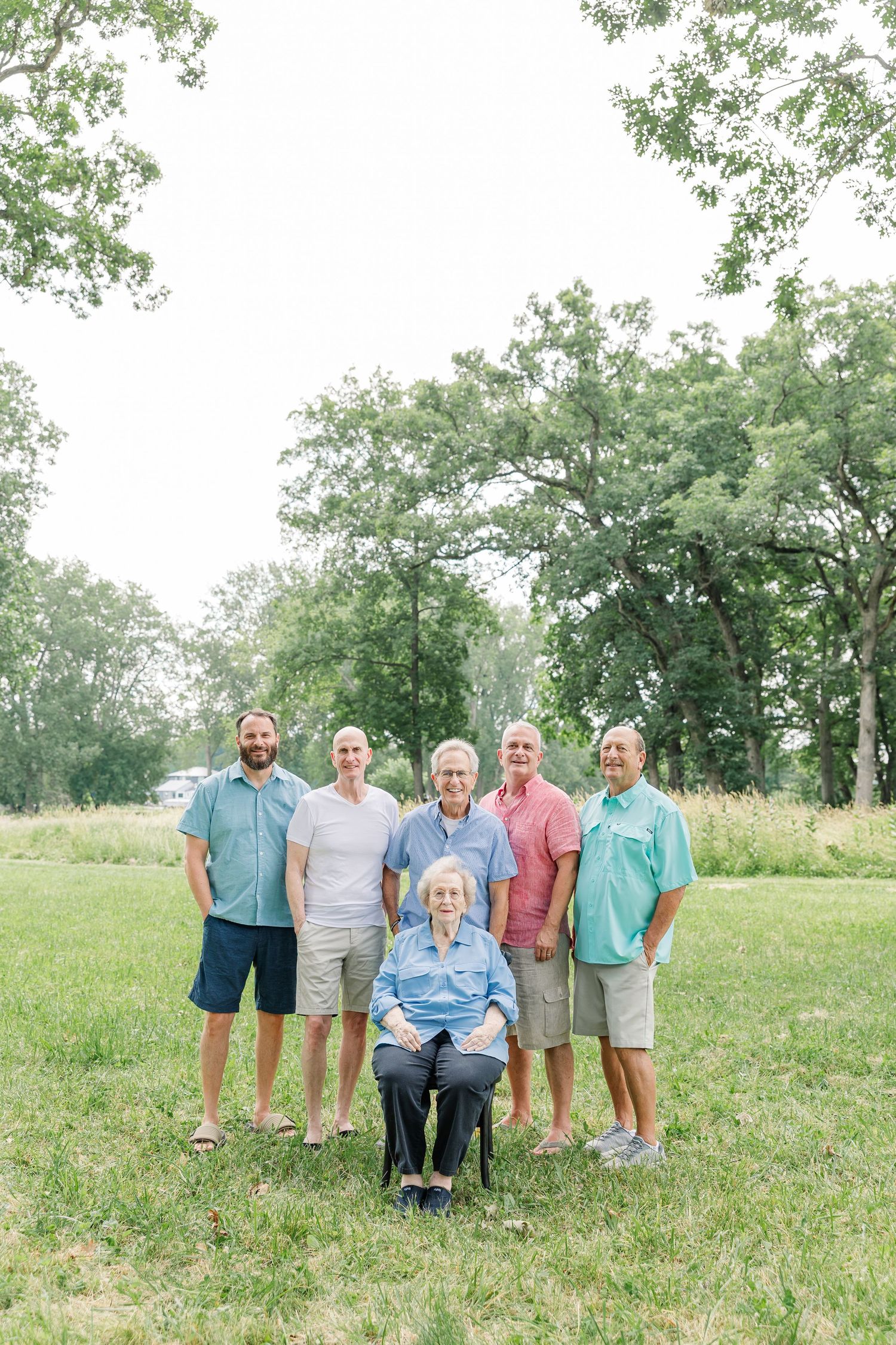 Grandparents with their adult children during an extended family portrait session in Crystal Lake, IL.