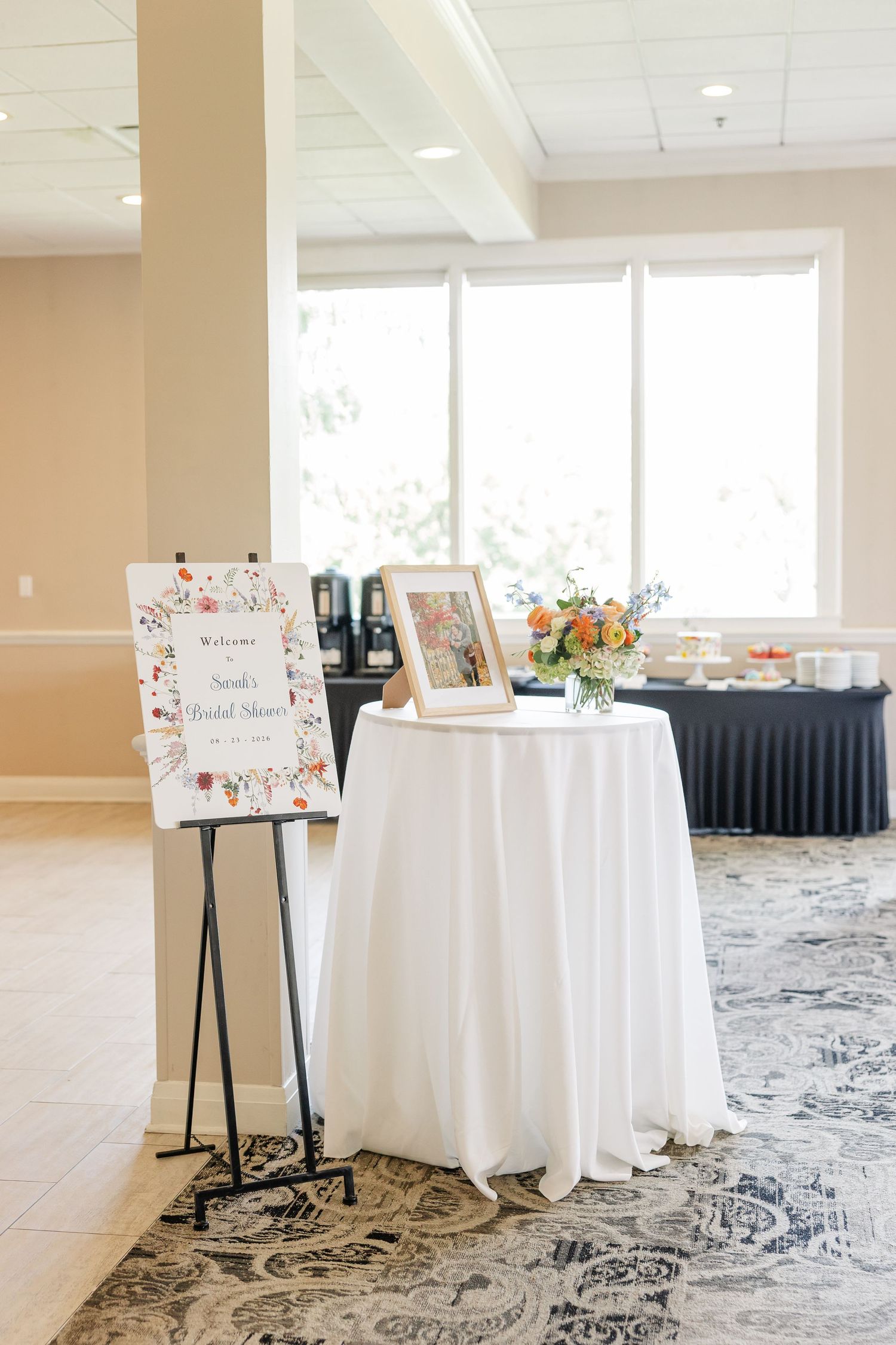 Welcome table display with framed photo at wildflower bridal shower, Itasca Country Club
