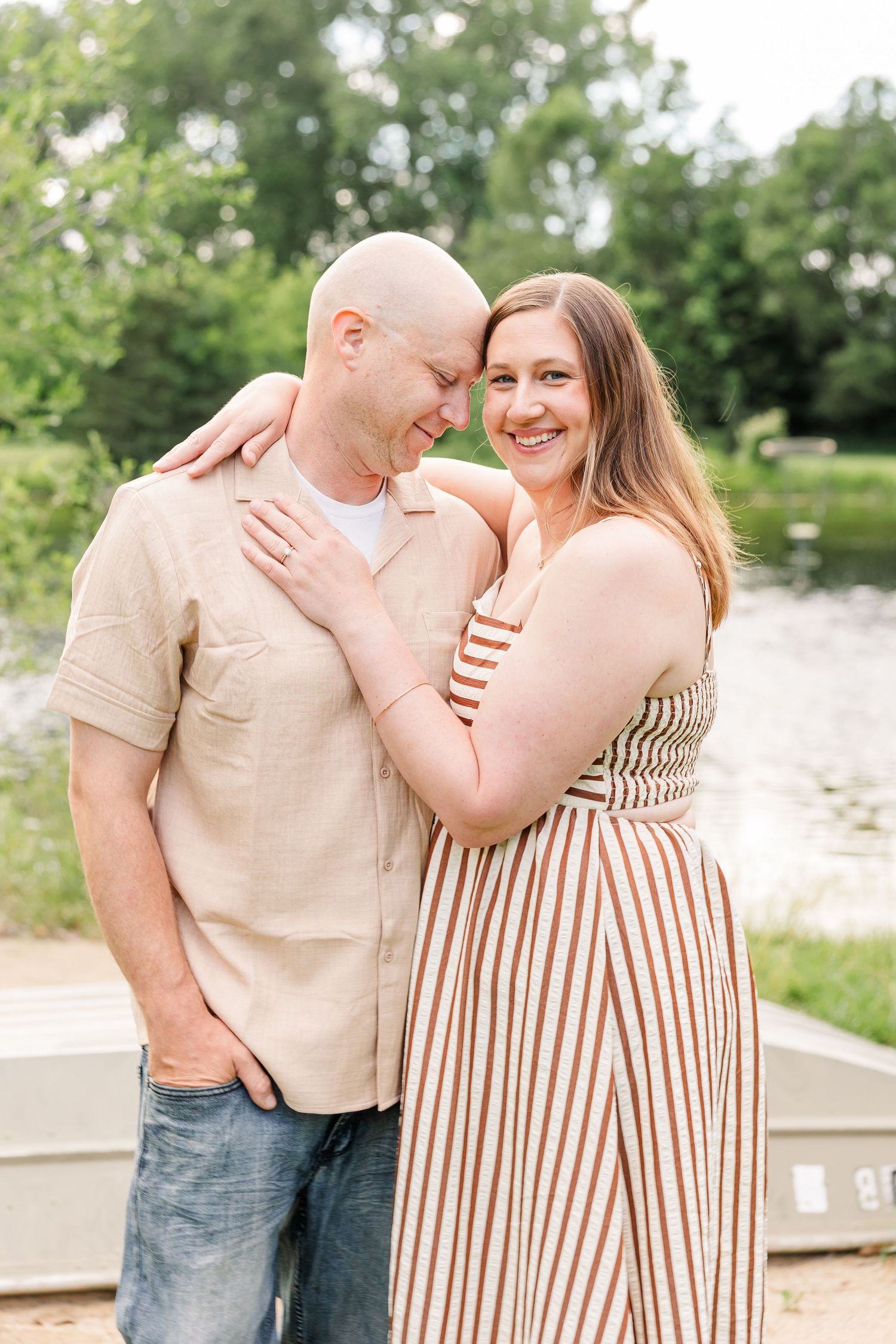 Mom and dad smiling together during a Crystal Lake family photography session at Shamrock Hills Park.