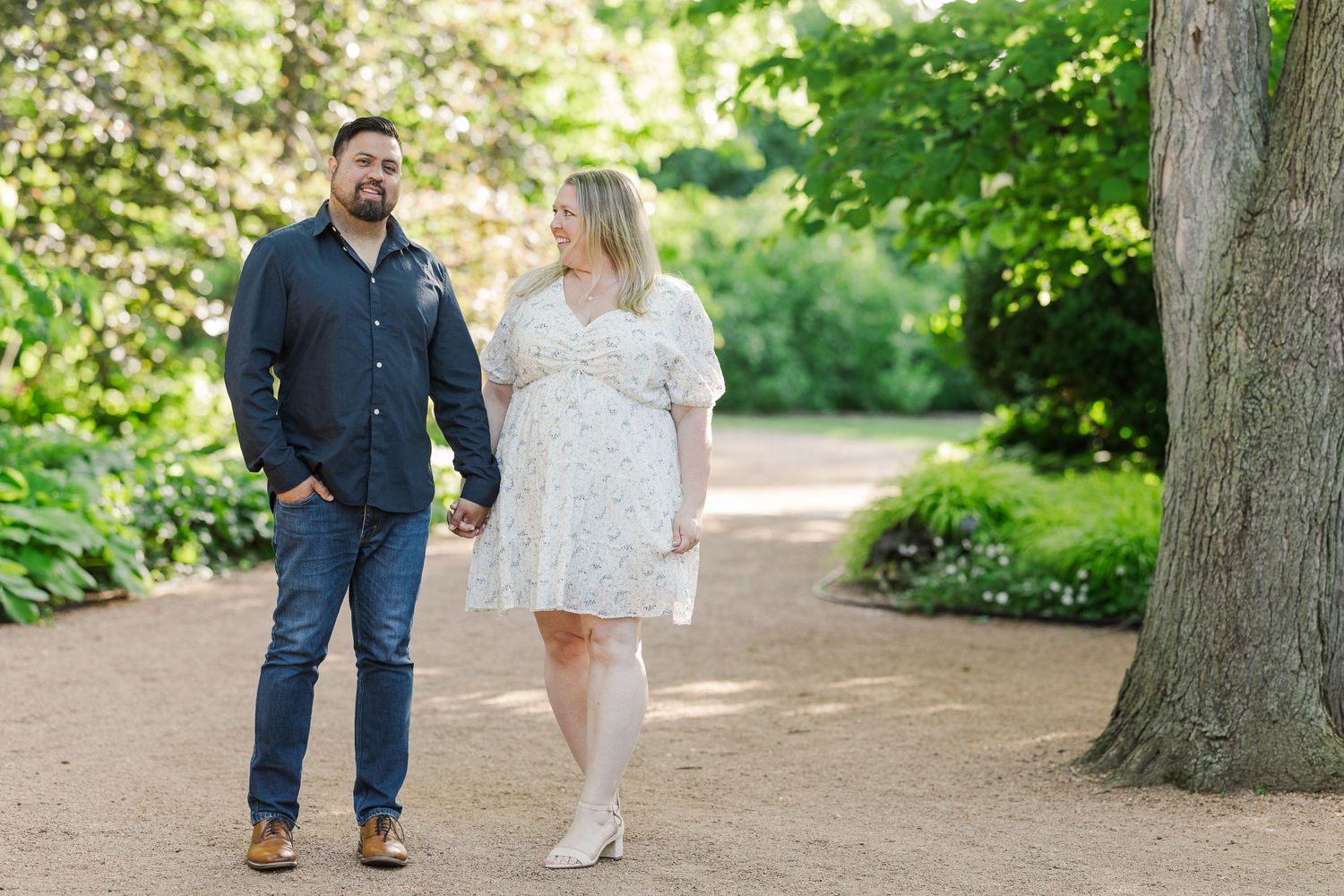 A casual springtime stroll along a tree-lined garden path.