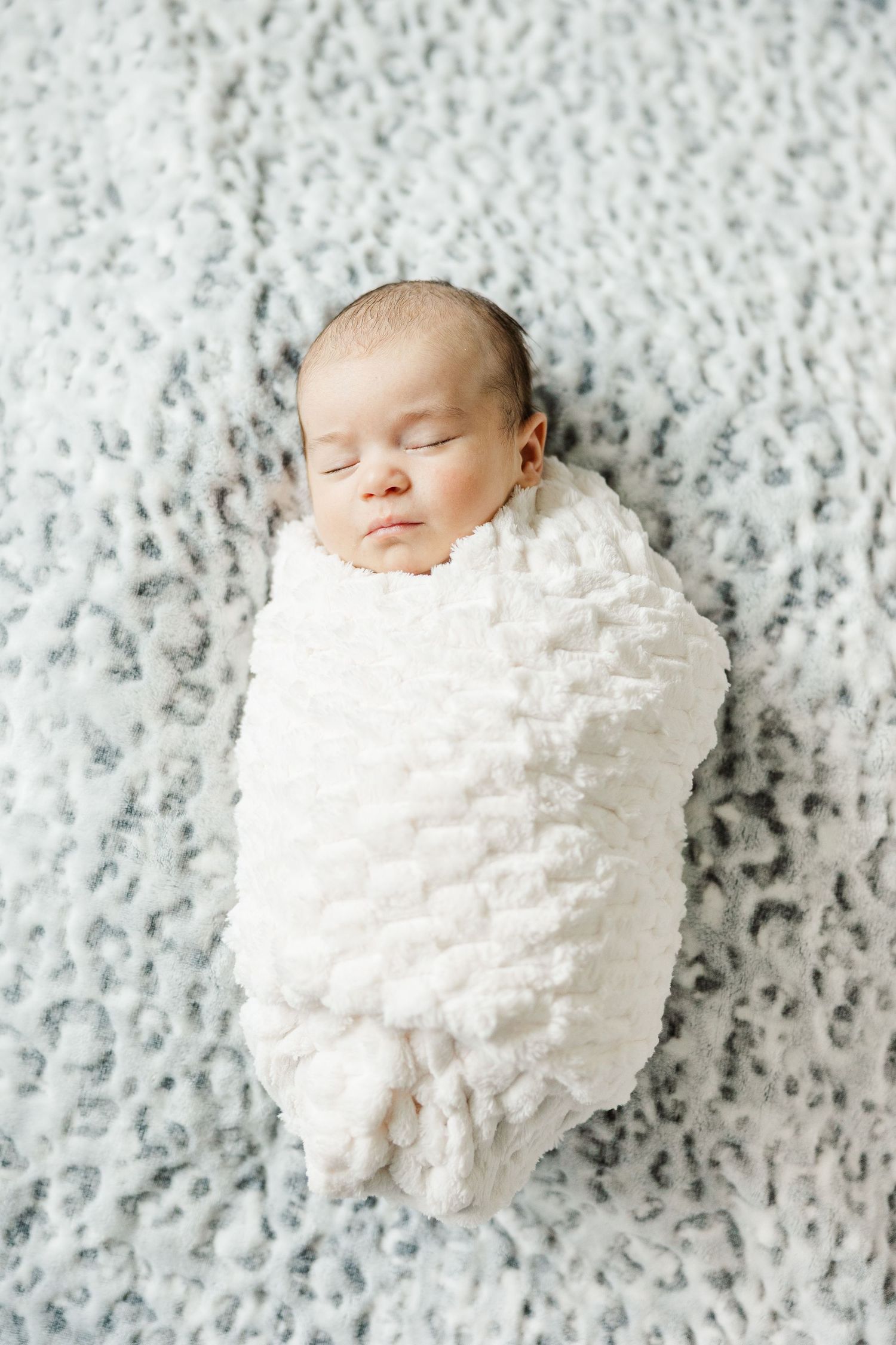 Close-up of a peacefully sleeping newborn during an in-home lifestyle newborn session in Palatine Illinois