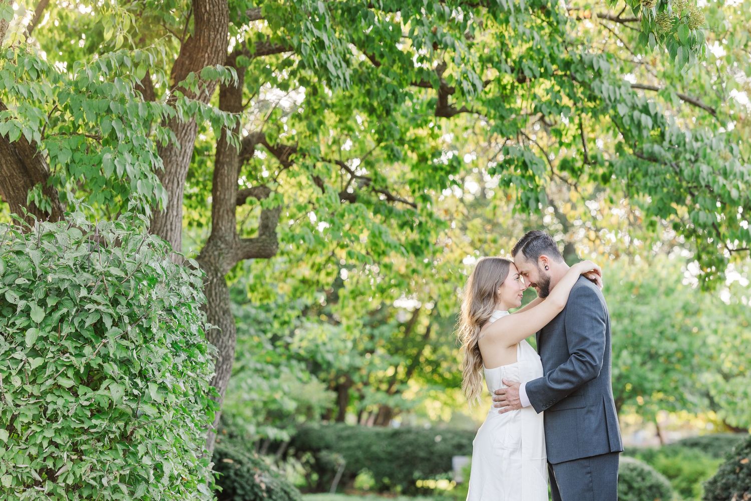 Couple embracing during engagement photos at Cantigny Park in Wheaton, Illinois