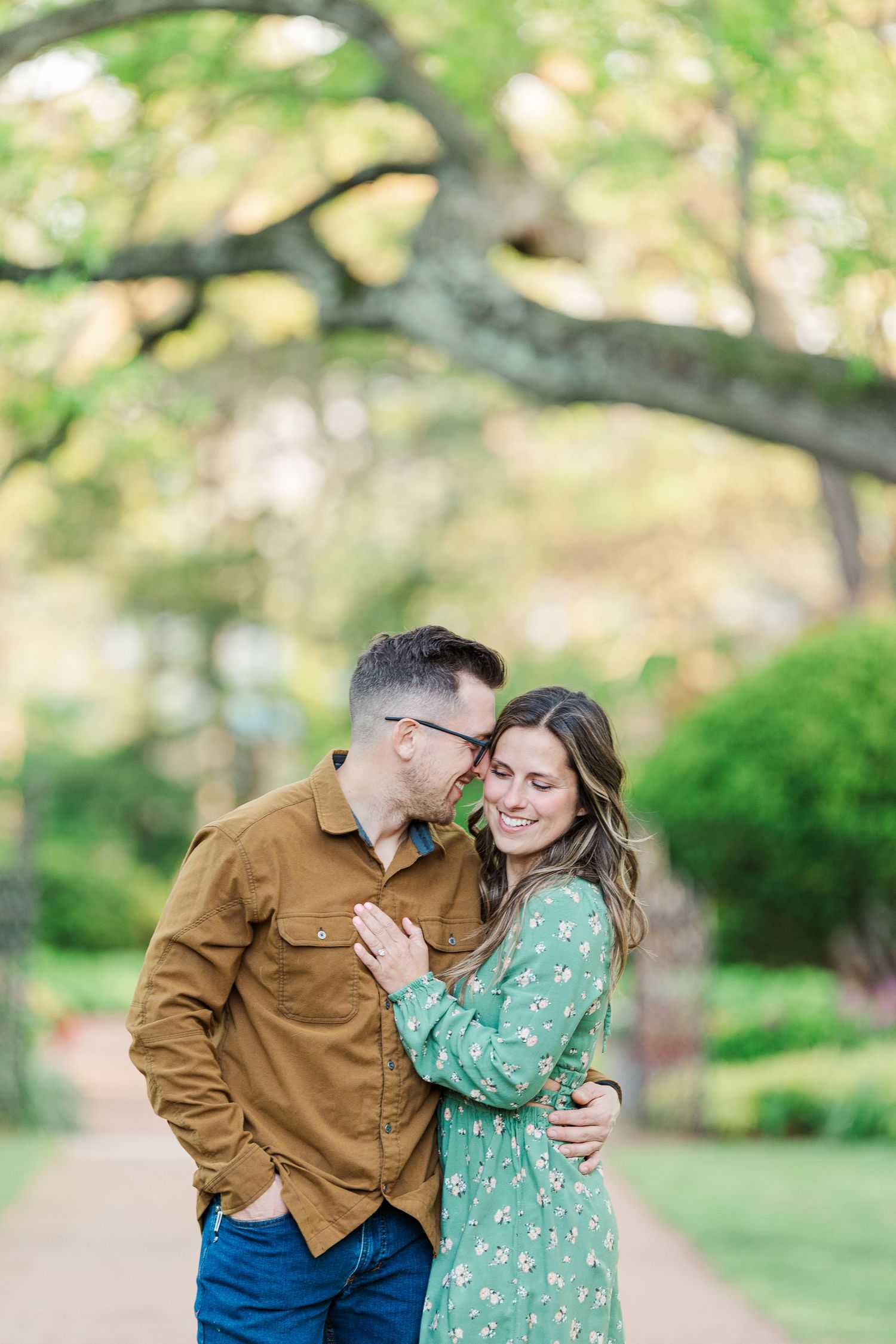 Engaged couple smiling together during their Cantigny Park engagement session