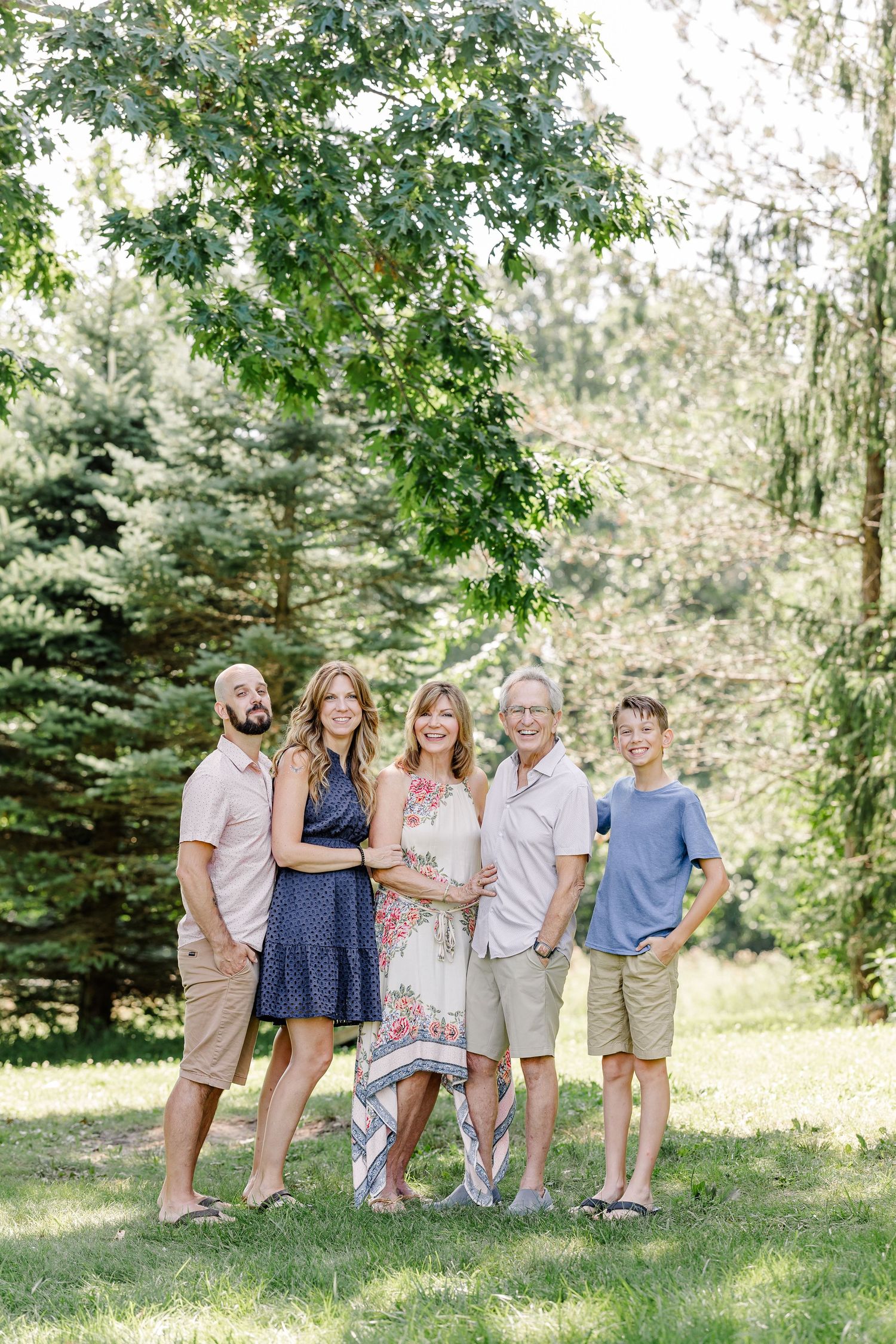 Grandparents posed with their children and grandchildren during a summer family session in Crystal Lake, Illinois.