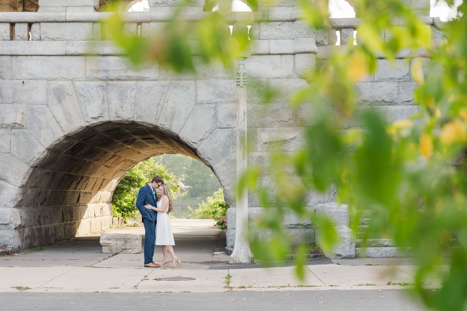 Elizabeth and Joe embracing under the Ulysses S. Grant Monument in Lincoln Park, Chicago