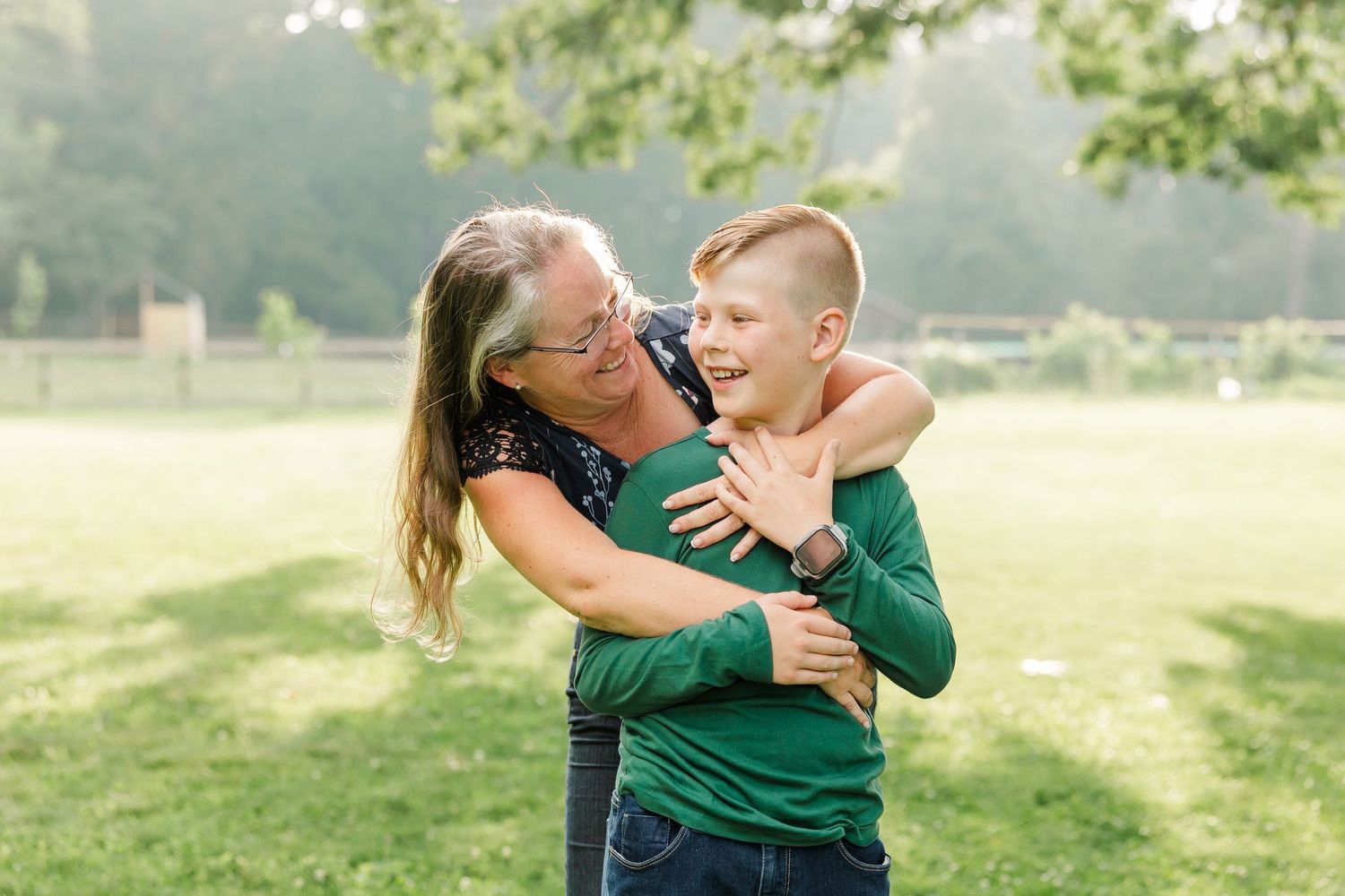 Aunt hugging her nephew during an at-home family session in Bull Valley, Illinois.