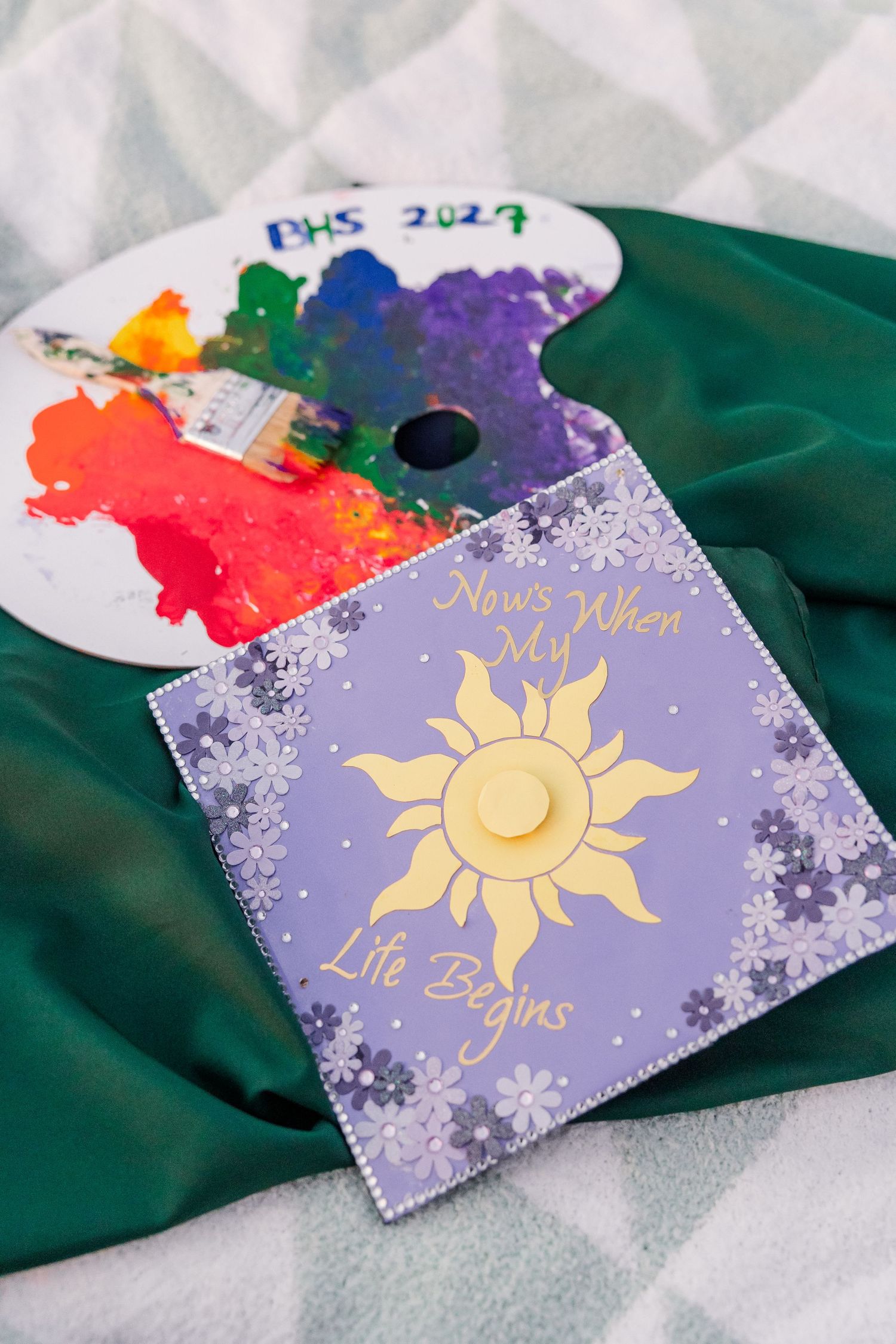 Tangled-inspired graduation cap and painted BHS 2027 palette created for Samantha’s artistic senior session.