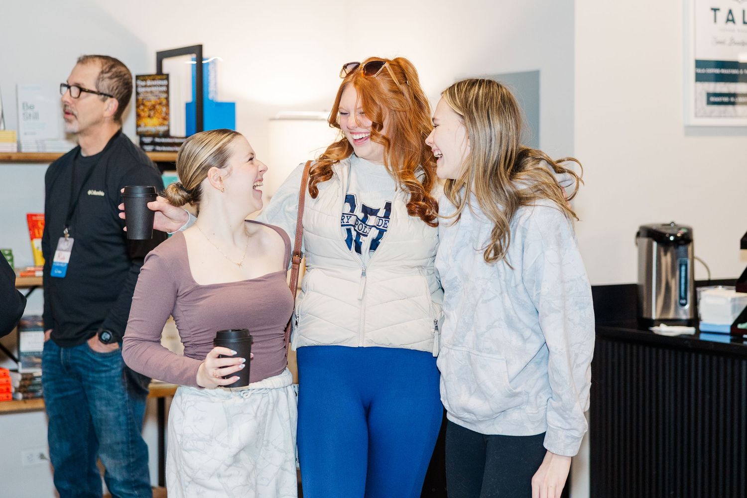 Women laughing together during a church gathering at The Chapel in McHenry