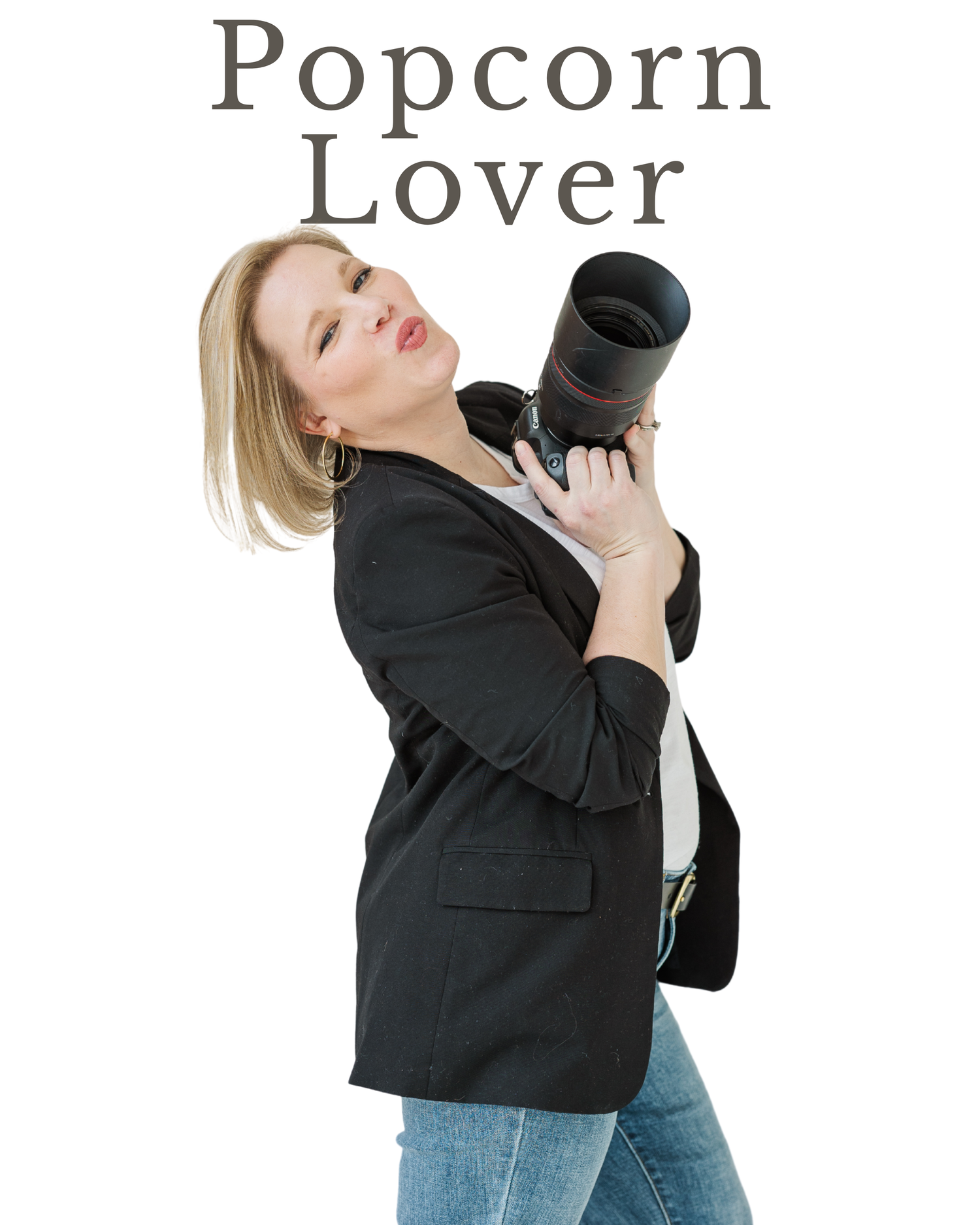 Cassie Lacina posing playfully with a camera during studio branding portraits