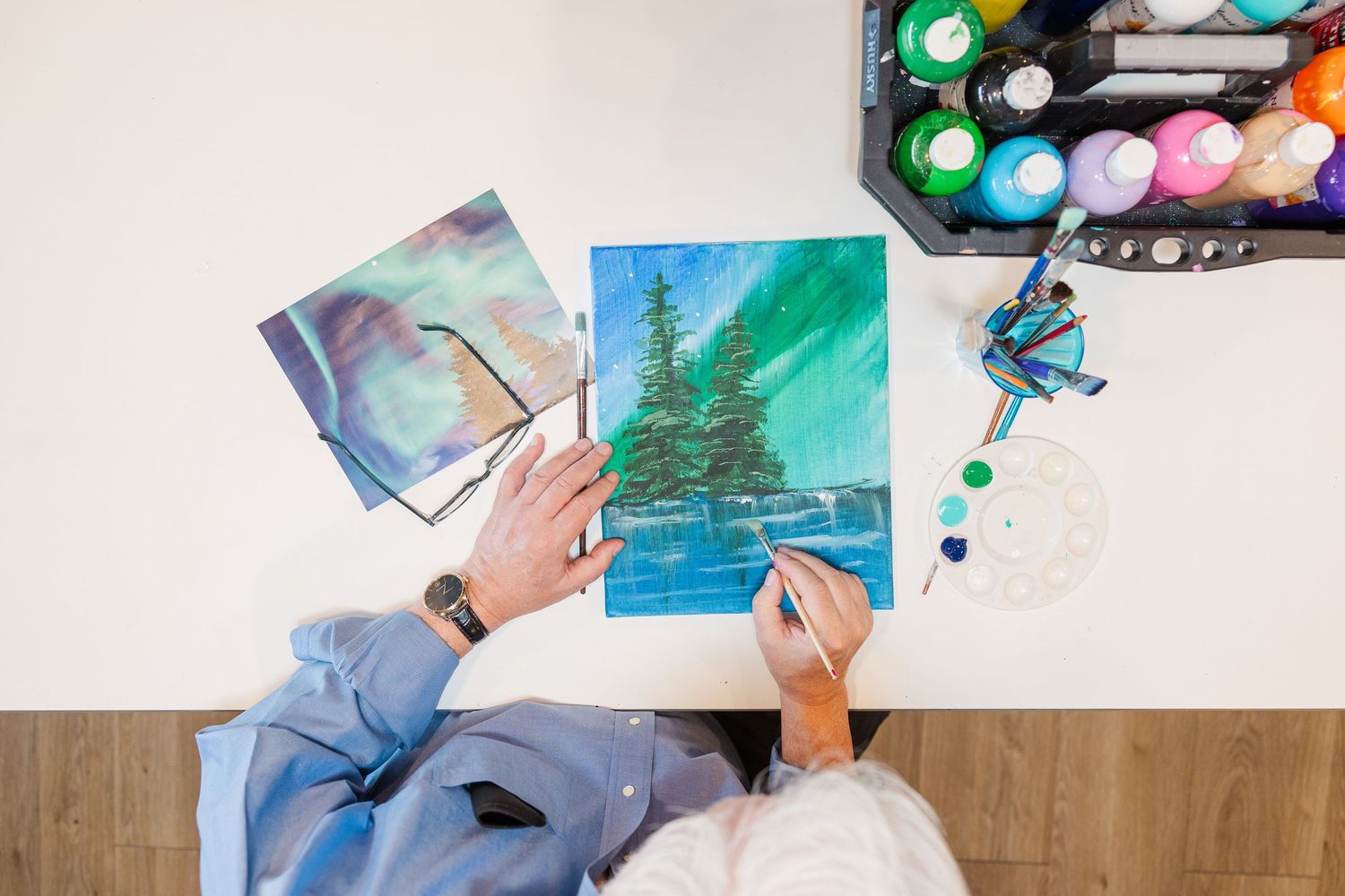 Beacon Hill senior living branding photo in Lombard, Illinois featuring watercolor art supplies on table