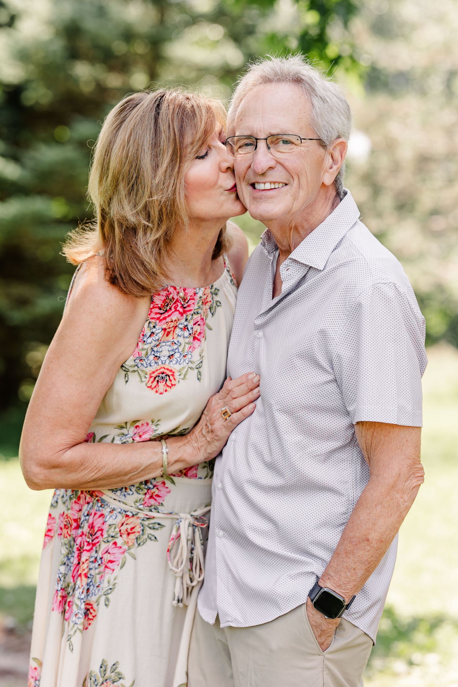 Couple smiling together outdoors during a summer family reunion photo session in Crystal Lake, IL.
