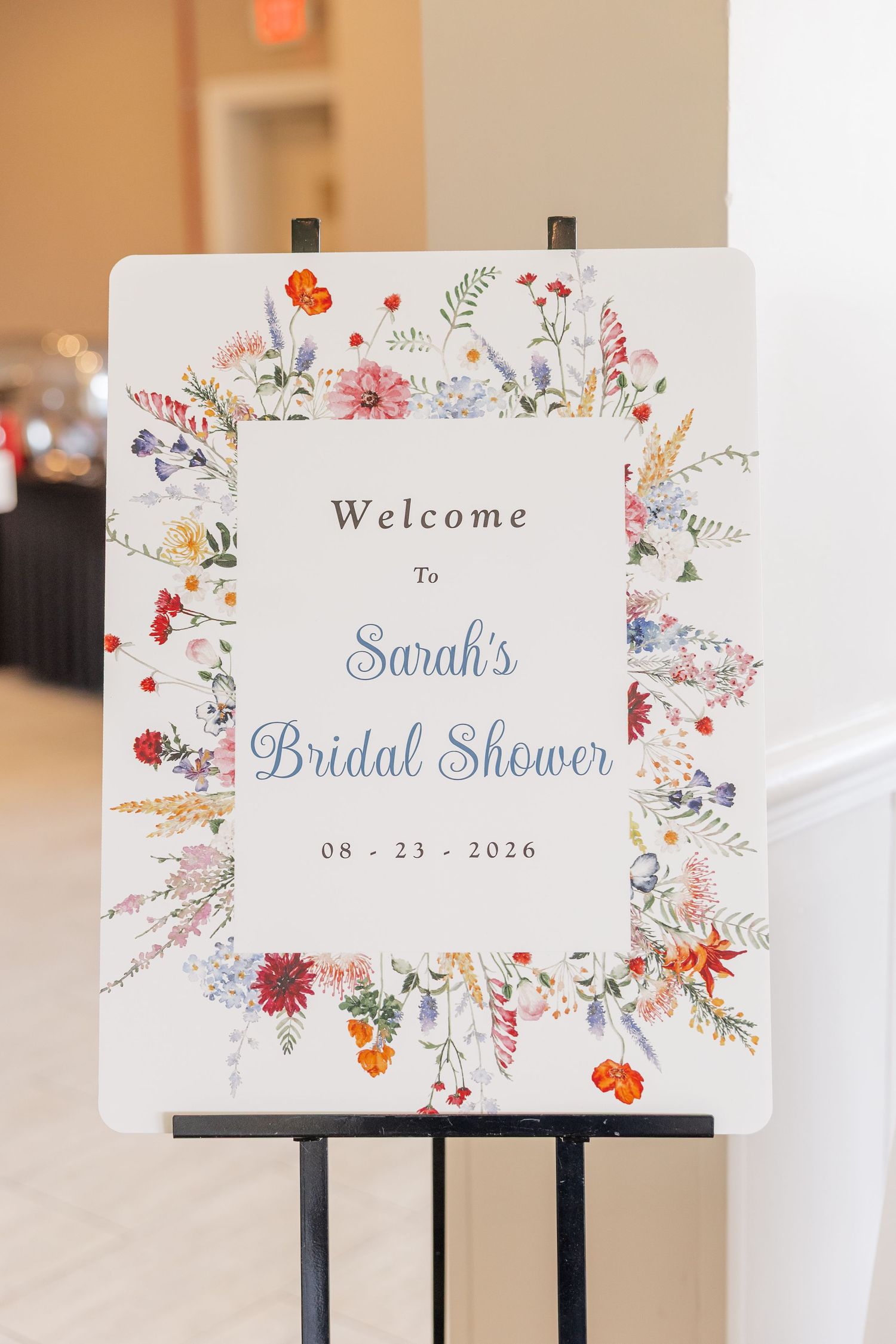 Watercolor floral welcome sign for Sarah's bridal shower at Itasca Country Club