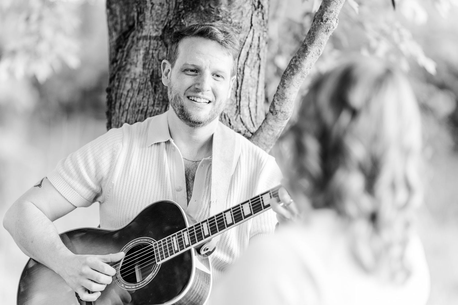 Black and white guitar portrait during a music-inspired maternity session in Crystal Lake.