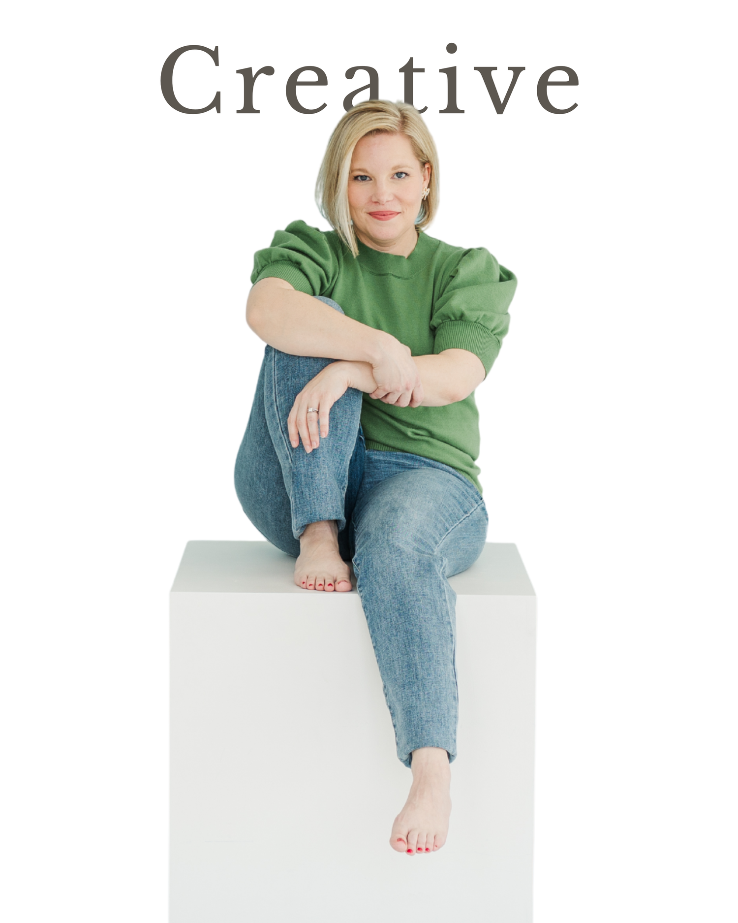 Cassie Lacina sitting on a white block during studio branding portraits
