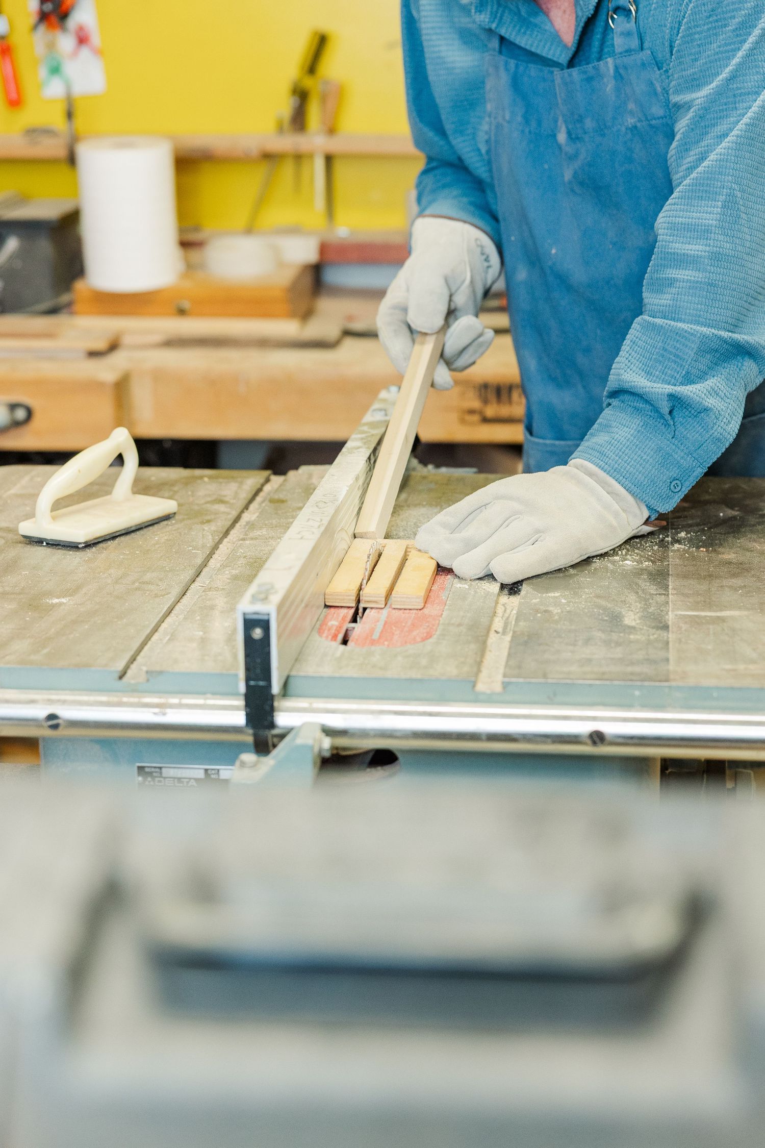 Beacon Hill senior living branding photo in Lombard, Illinois featuring resident using table saw in workshop