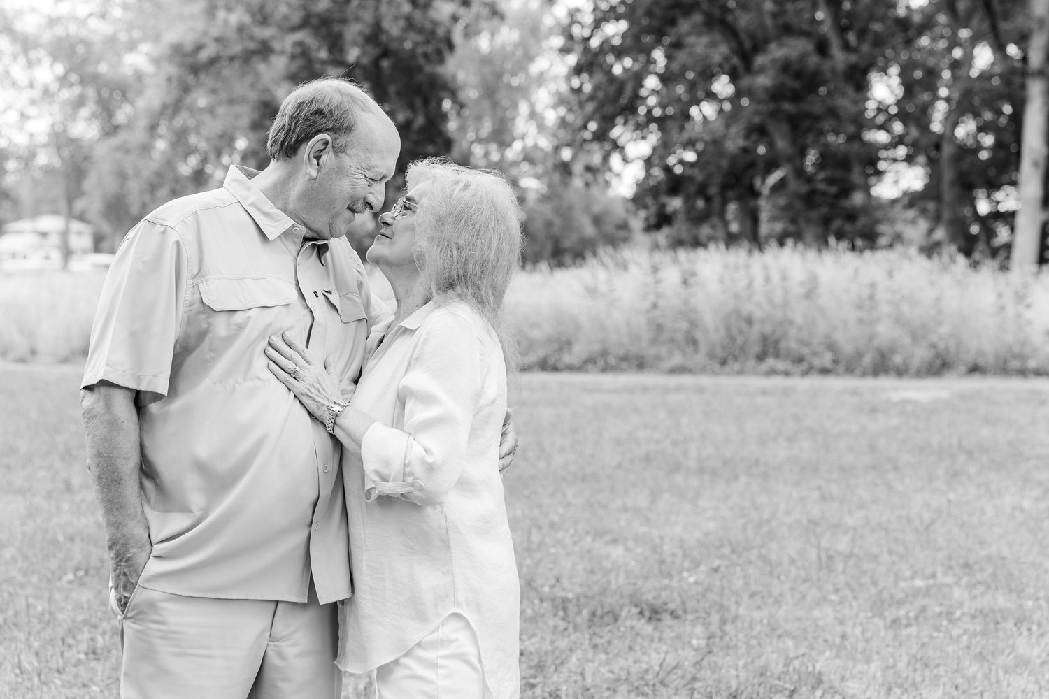 Black and white portrait of grandparents sharing a sweet moment during an extended family session in Crystal Lake, IL.