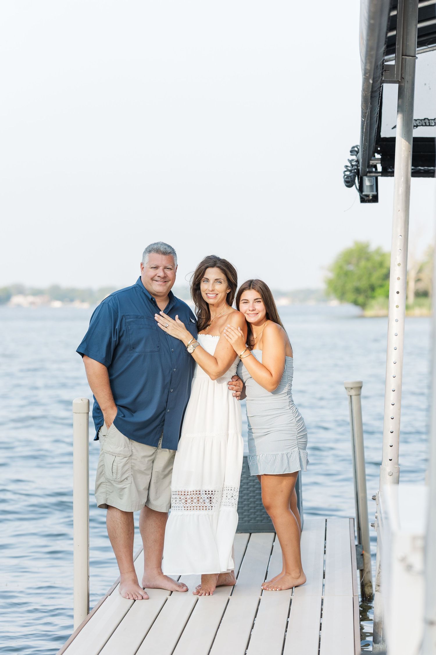 Family standing on dock during Pistakee Lake family photos in Johnsburg, Illinois