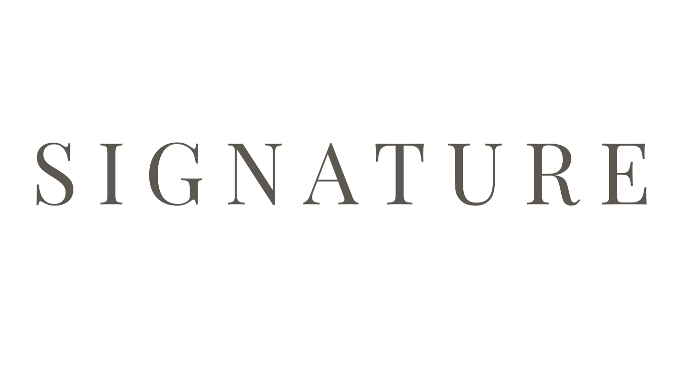 Elegant signature text in metallic silver letters against a white background.