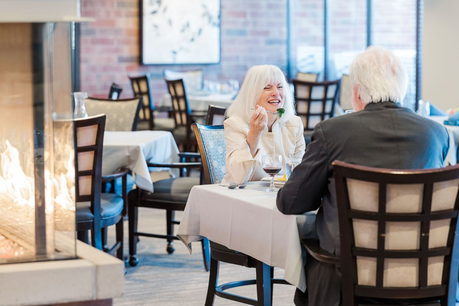 Beacon Hill senior living branding photo in Lombard, Illinois featuring residents dining in restaurant
