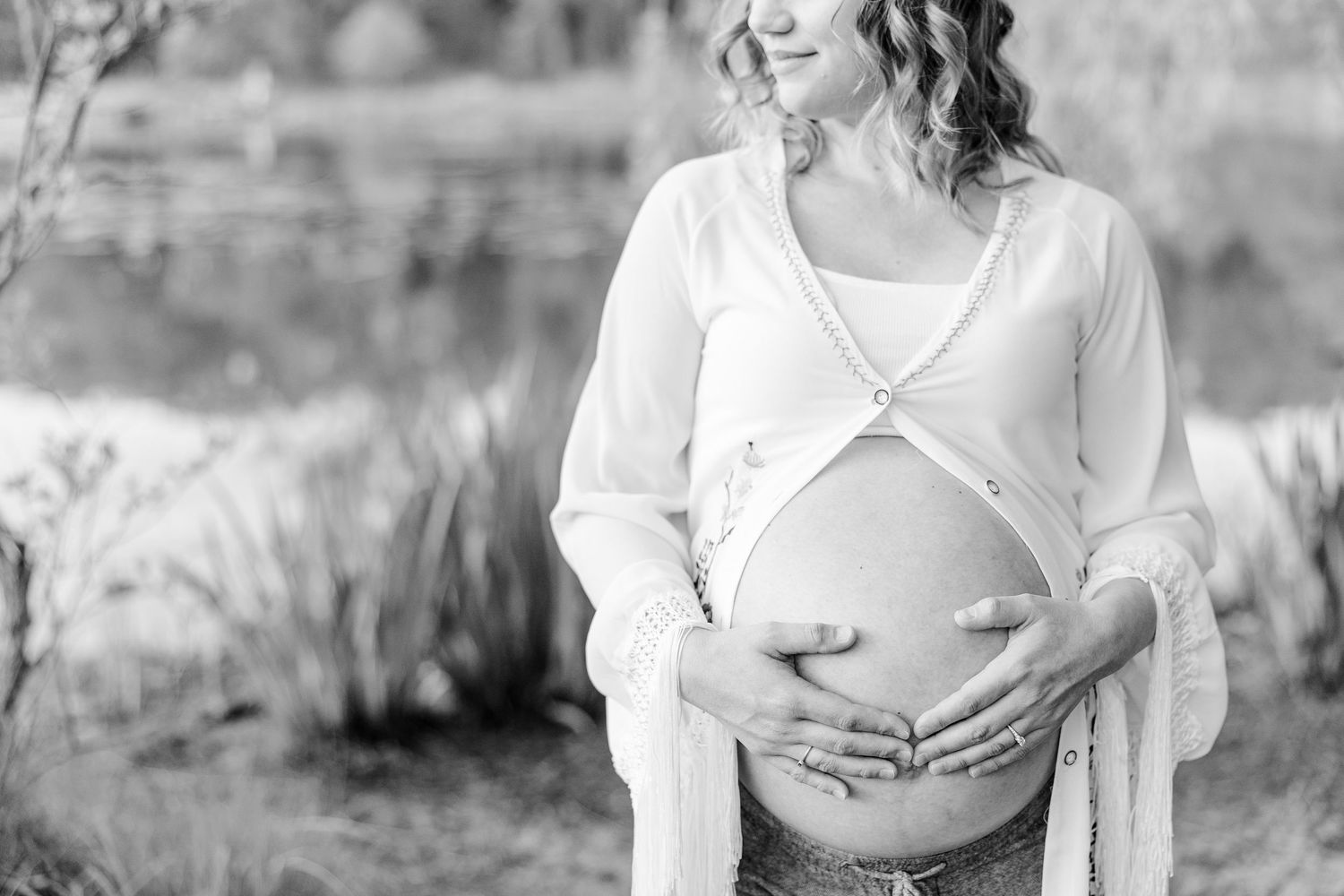 Black and white close-up maternity portrait during a golden hour session at Veterans Acres.