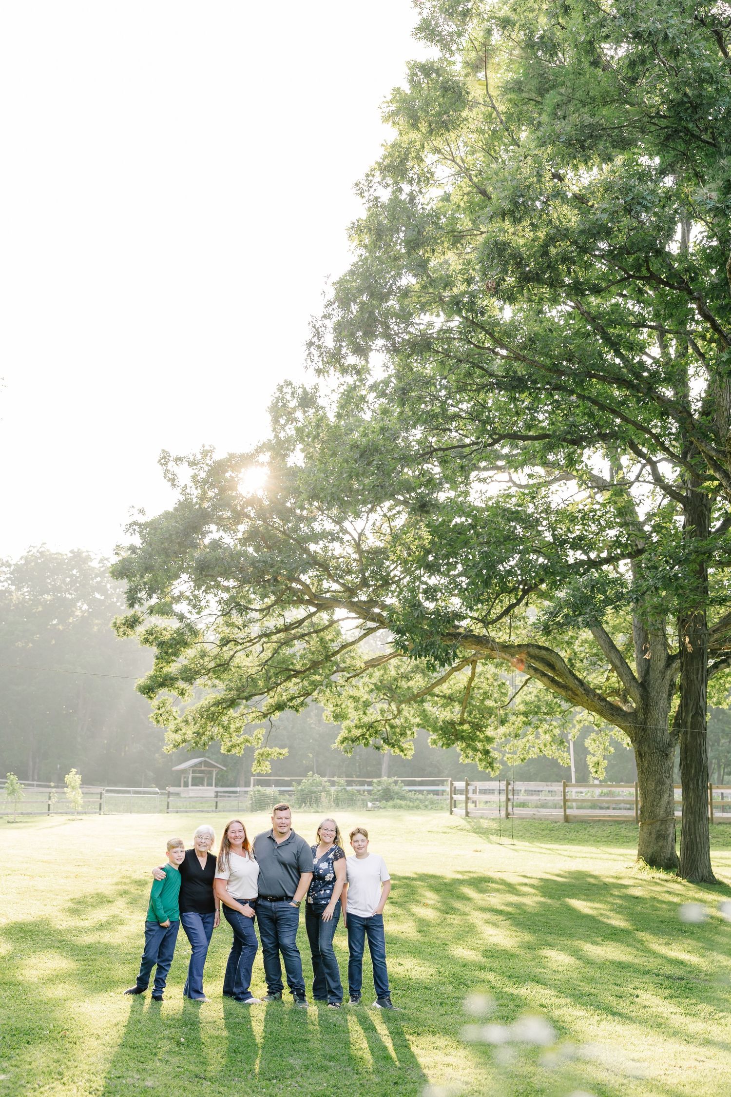 Family standing together in the evening light in Bull Valley, Illinois.