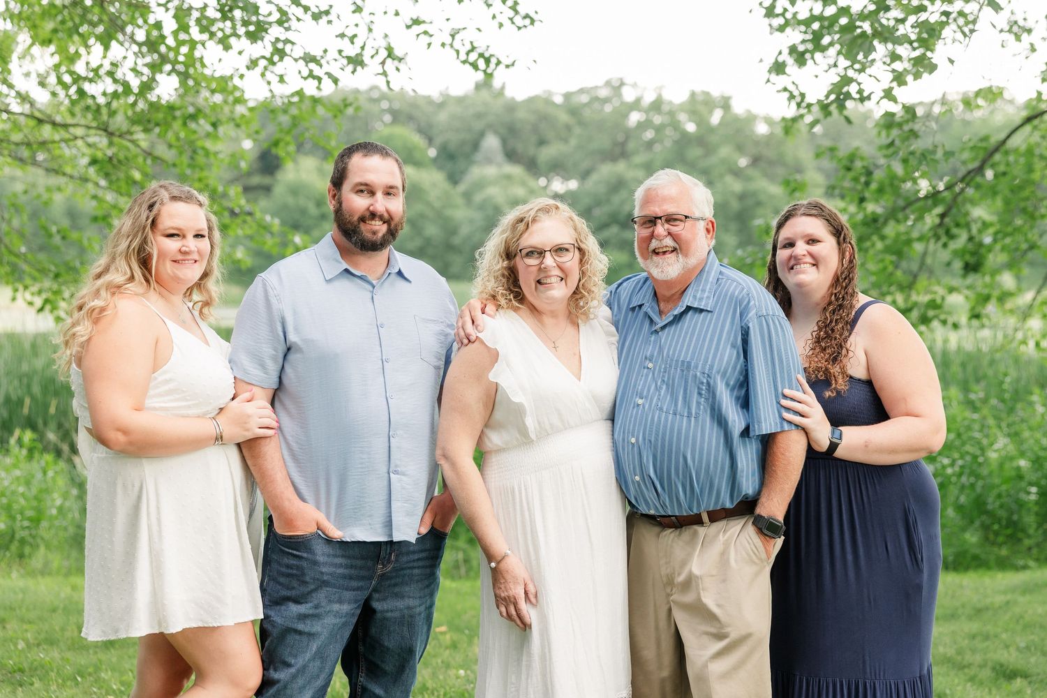 Extended family portrait with grandparents and grown children during a summer session in Crystal Lake, Illinois