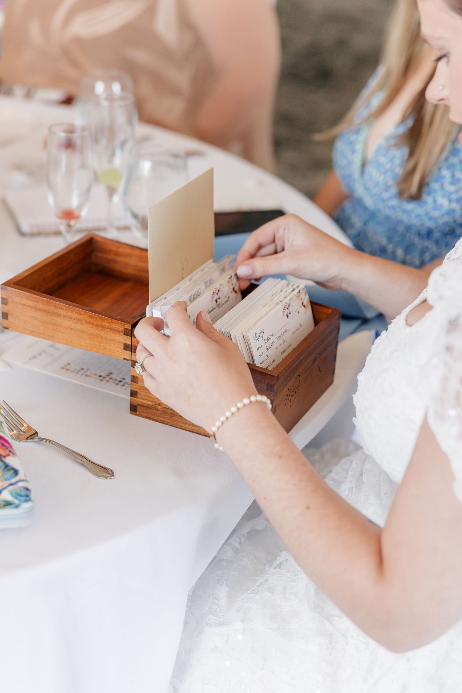 Bridal shower guest writing a card of advice for Sarah at Itasca Country Club