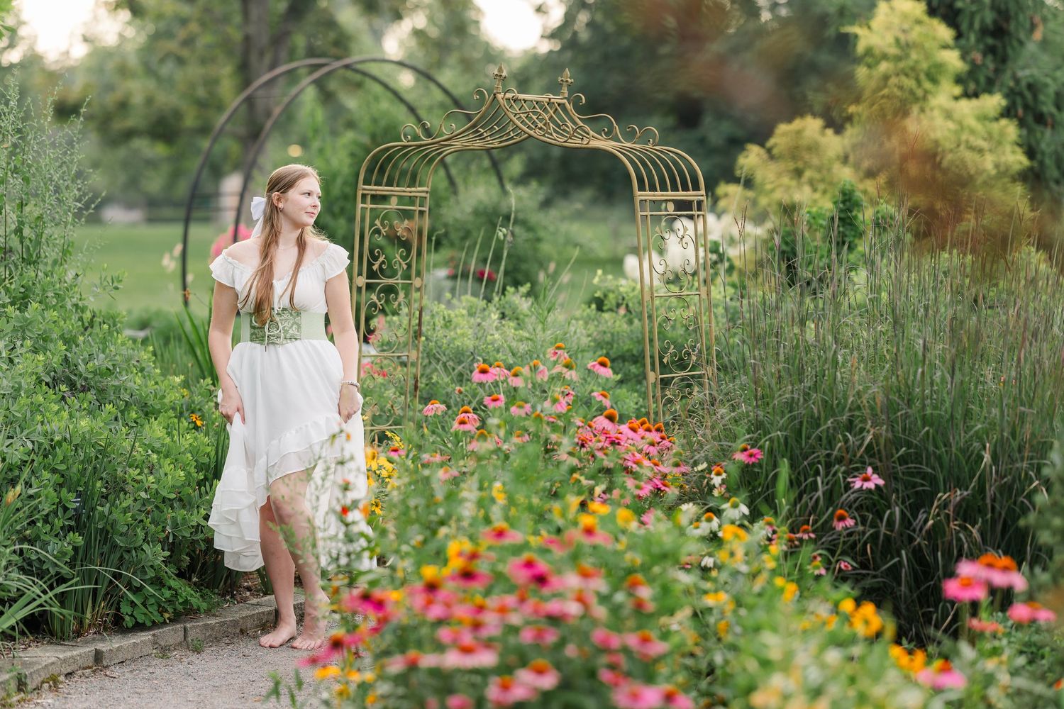 Wide portrait of Samantha surrounded by colorful flowers in the gardens at Cantigny Park in Wheaton.