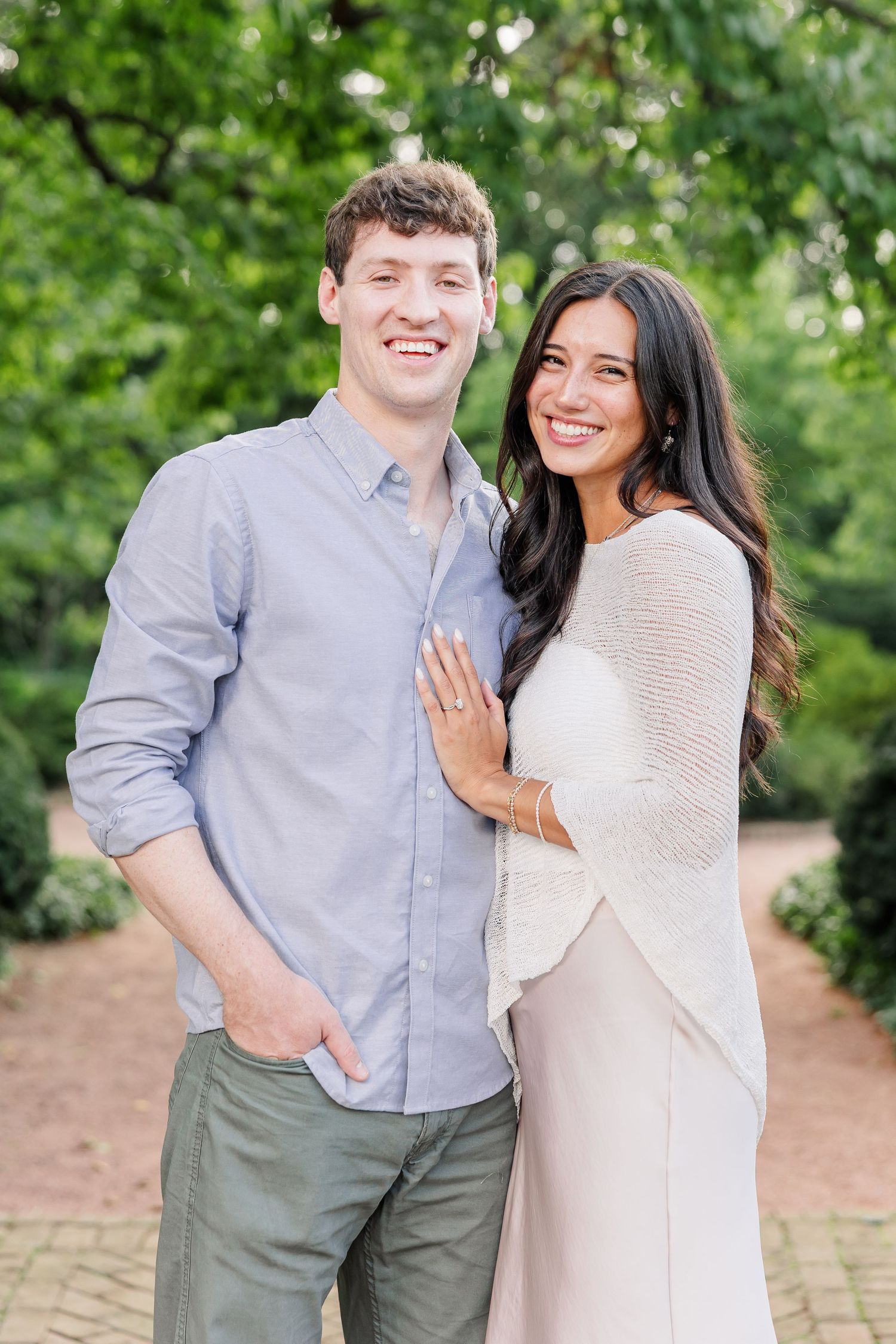 Alysia and Jack smile for their first portraits together as an engaged couple.