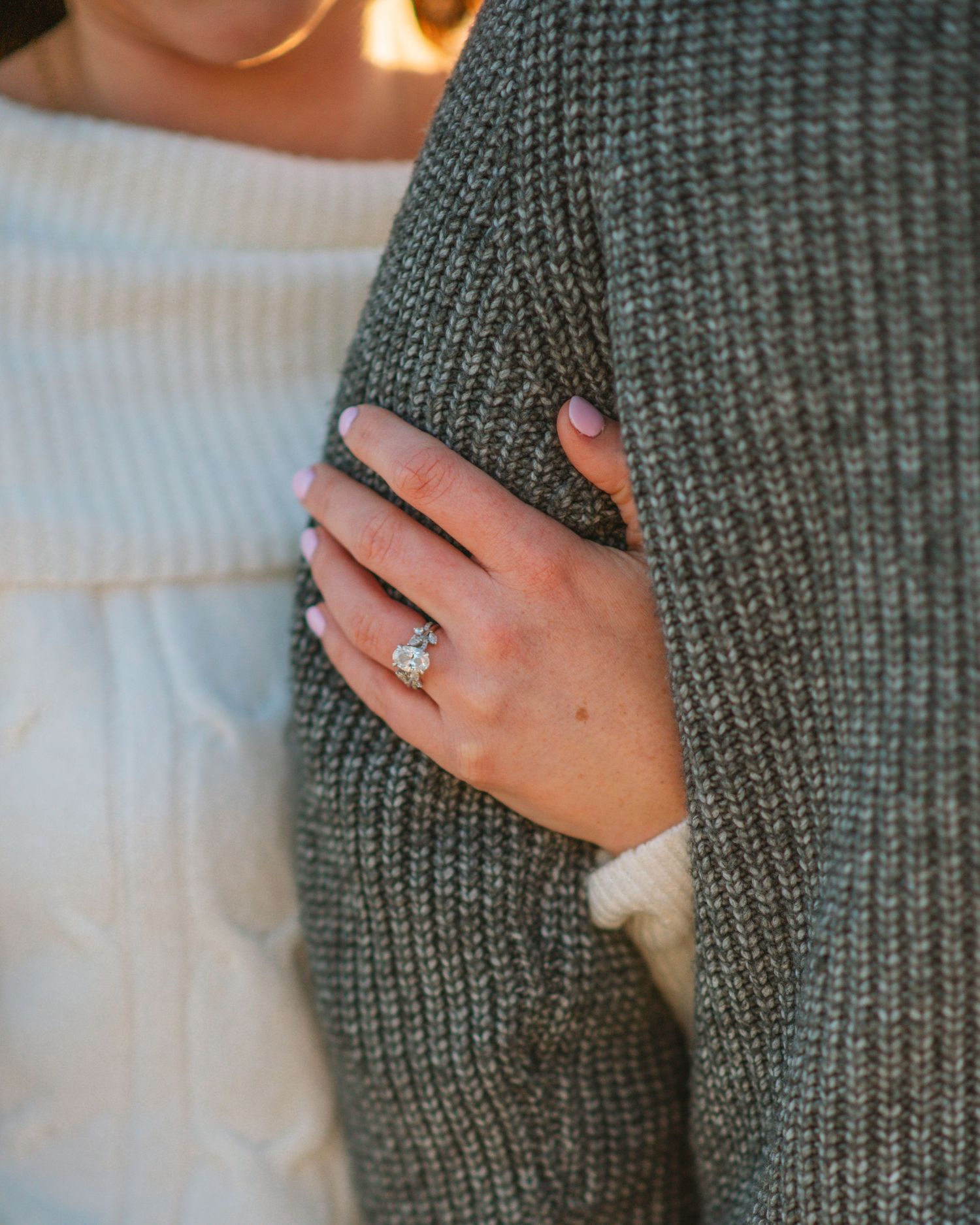 Close-up of engagement ring on hand during a beach couples session at sunset.
on Sullivans Island, Charleston SC