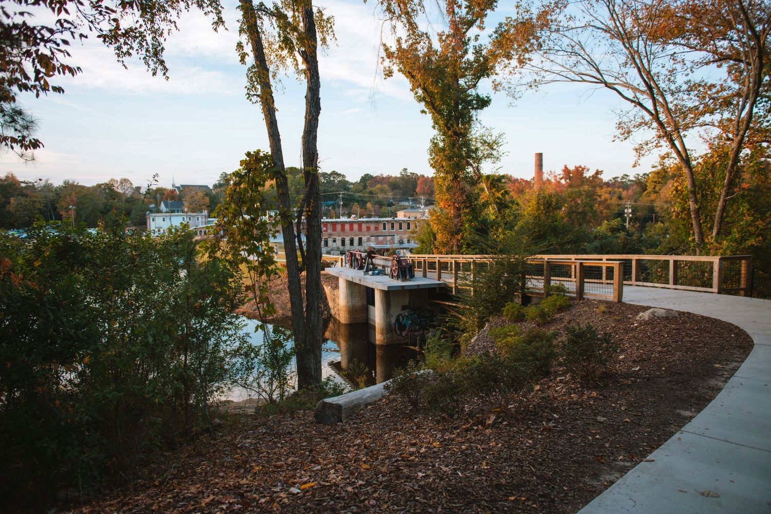 Old Mill Pond in Lexington SC, a charming family photo spot with water, rustic scenery, greenery, and timeless outdoor portraits.