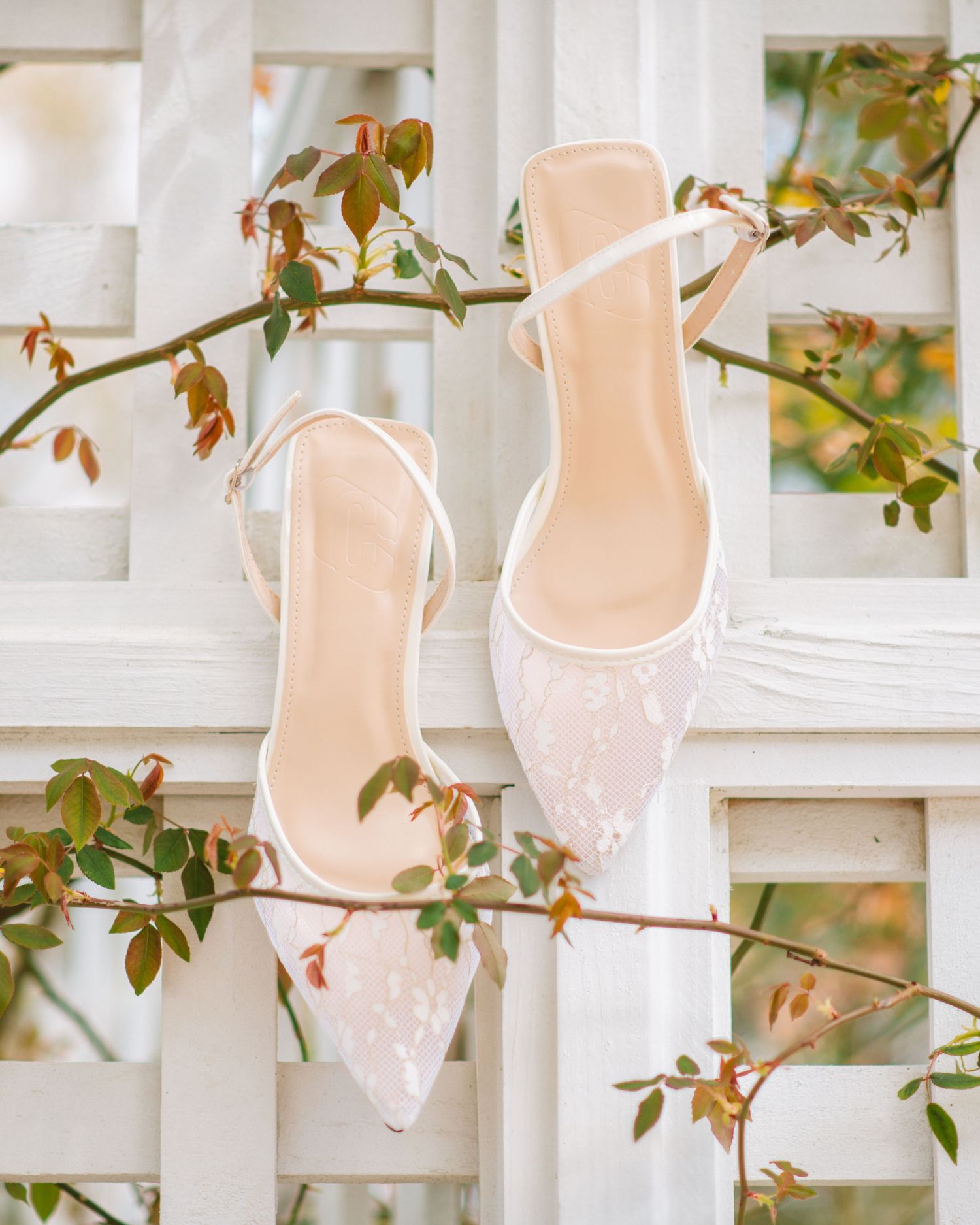 Elegant bridal heels displayed with greenery for a soft and romantic wedding detail photo. Magnolia Plantation and Gardens